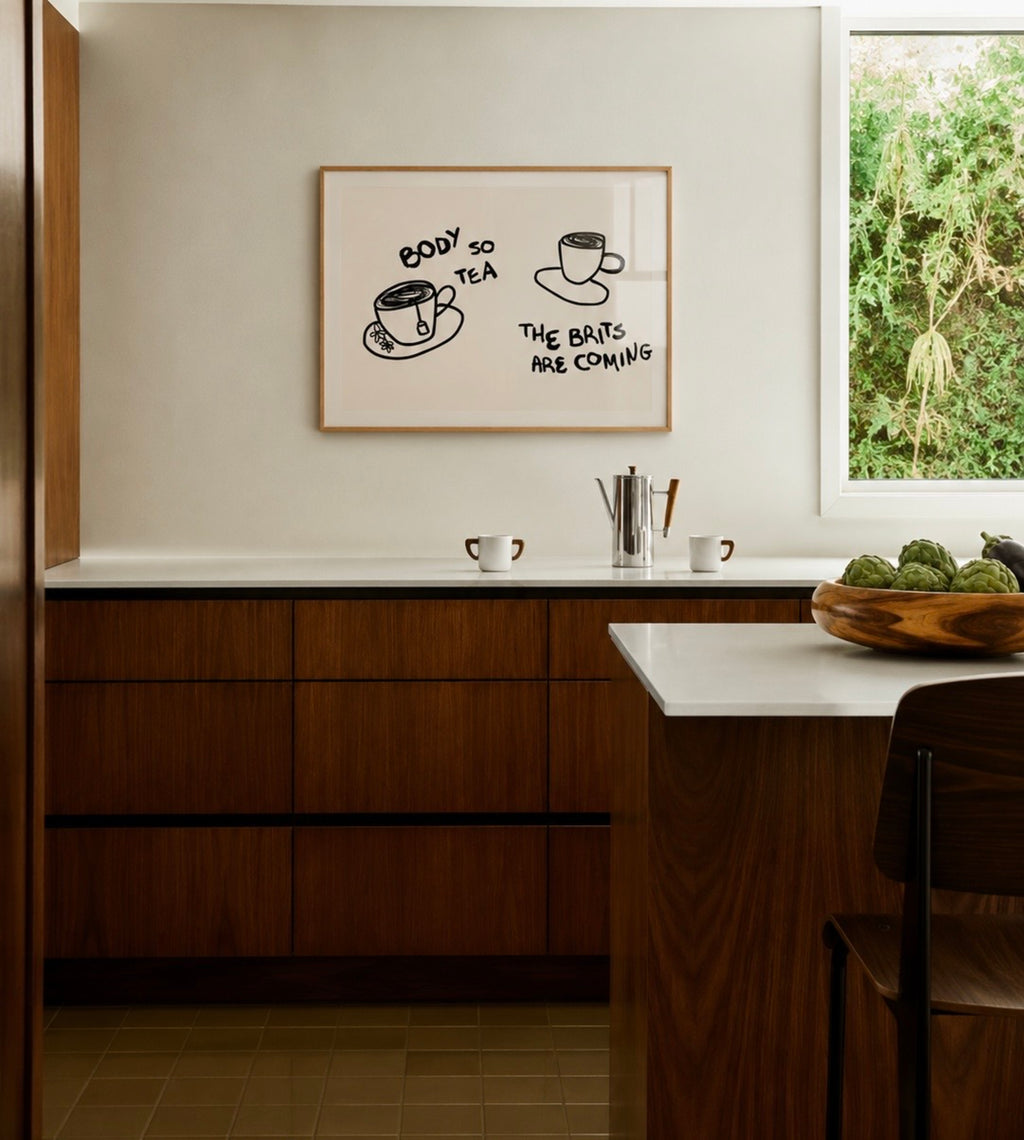 Body so tea the brits are coming is a humorous minimal typography wall art print, with two hand-drawn cups and playful whimsical handwritten lettering, adding charm, humour and effortless character to kitchens, breakfast nooks, dining spaces, coffee stations and tea corners, a conversation piece Inspired by café culture, slow mornings, blending contemporary minimalism with playful illustration