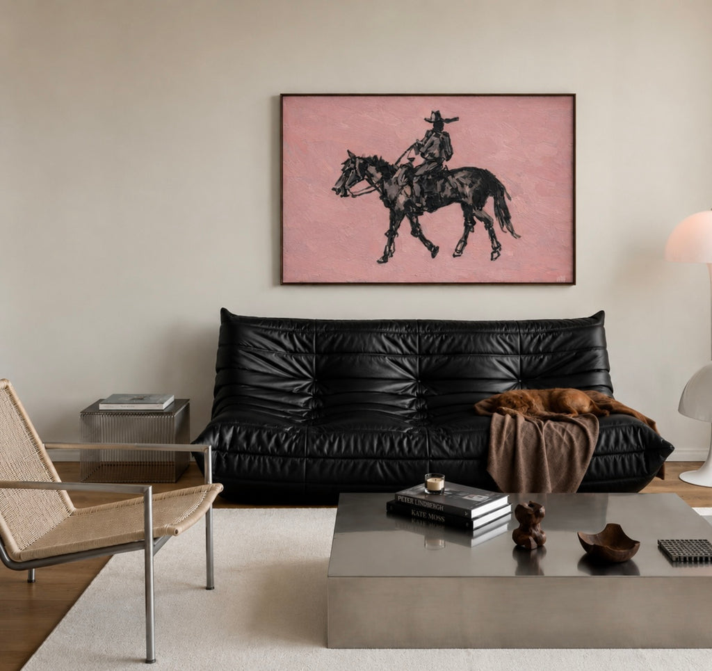 The Lone Rider is a minimalist Western Horse Artwork Featuring solitary rider cowboy on horseback against dusty rose pink background. This is a western Cowboy Oil painting wall art with painterly effect