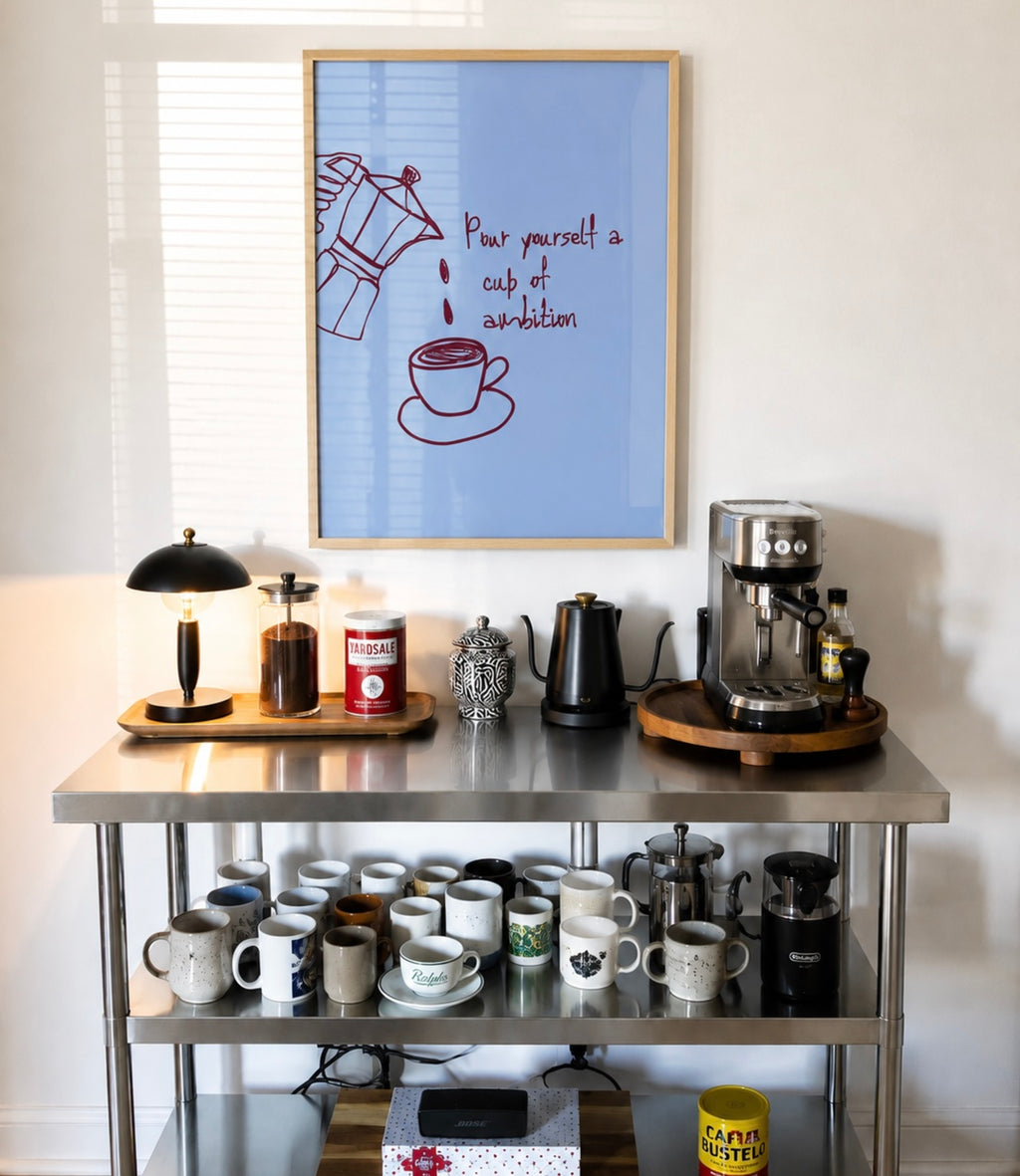 POUR YOURSELF A CUP OF AMBITION  is a humorous minimal typography wall art print, with two hand-drawn coffee cup illustration and playful whimsical handwritten lettering, adding charm, humour and effortless character to kitchens, breakfast nooks, dining spaces, coffee stations and tea corners, a conversation piece Inspired by café culture, slow mornings, blending contemporary minimalism with playful illustration