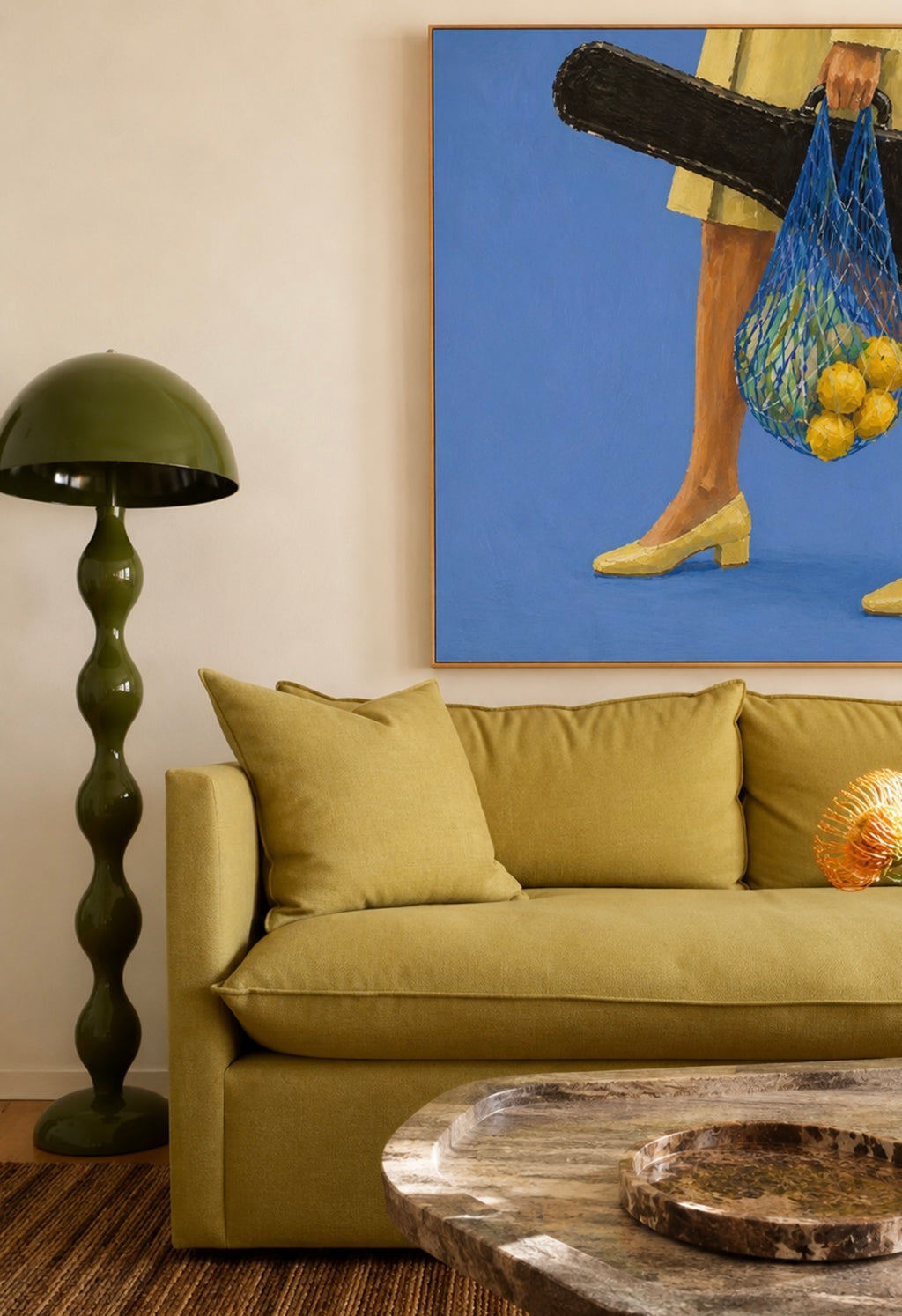 The Lemon Walk hand painted Contemporary and figurative wall art of a woman carrying lemons in a net bag alongside a guitar case against a blue background with expressive painterly texture. Minimalist Mid century modern Summer oil painting with lemons, vintage heels and a guitar case in cinematic composition