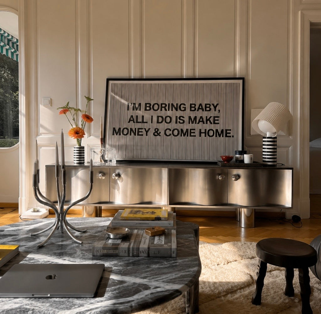 hand drawn Playful Funny typography print with the phrase "IM BORING BABY ALL I DO IS MAKE MONEY AND COME HOME" in a retro striped neutral canva. This is a trendy funny typography wall art print ideal for above bed, bedrooms, dorm room decor, living rooms and kitchens, gallery walls and playful interiors. The perfect Cool Girl Apartment decor