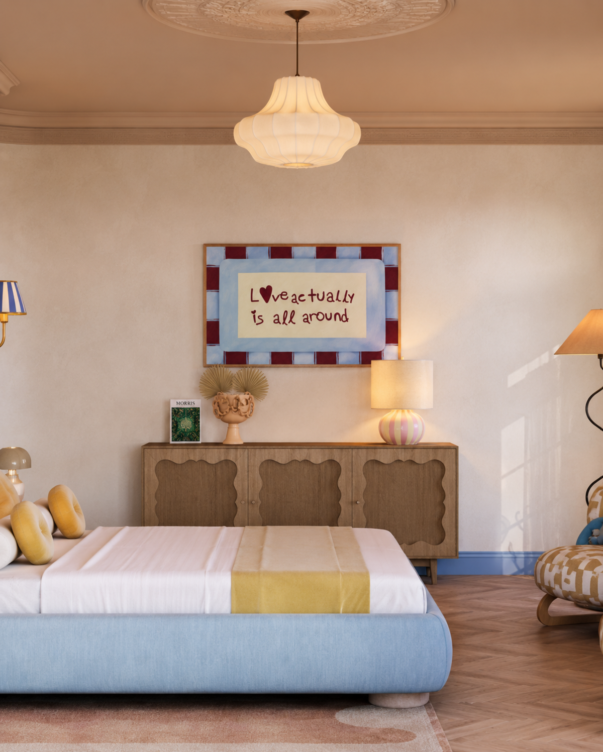 A styled bedroom interior featuring a light blue upholstered bed with white bedding and a yellow accent stripe, set against a beige wall with a wooden cabinet, framed art, and warm ambient lighting.