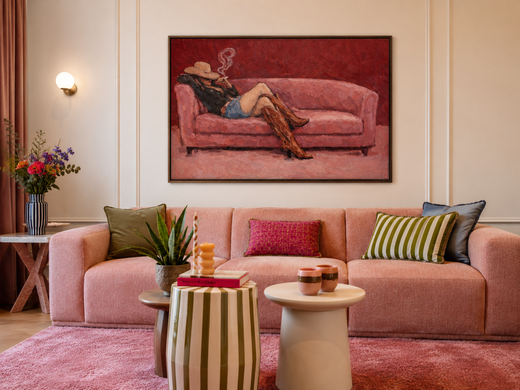 abstract Western wall art featuring an off-duty cowgirl reclining on a blush dusty pink sofa in cowboy boots and cowboy hat, inspired by western and contemporary folk aesthetics. This is a hand drawn Contemporary western art Print Oil Painting.