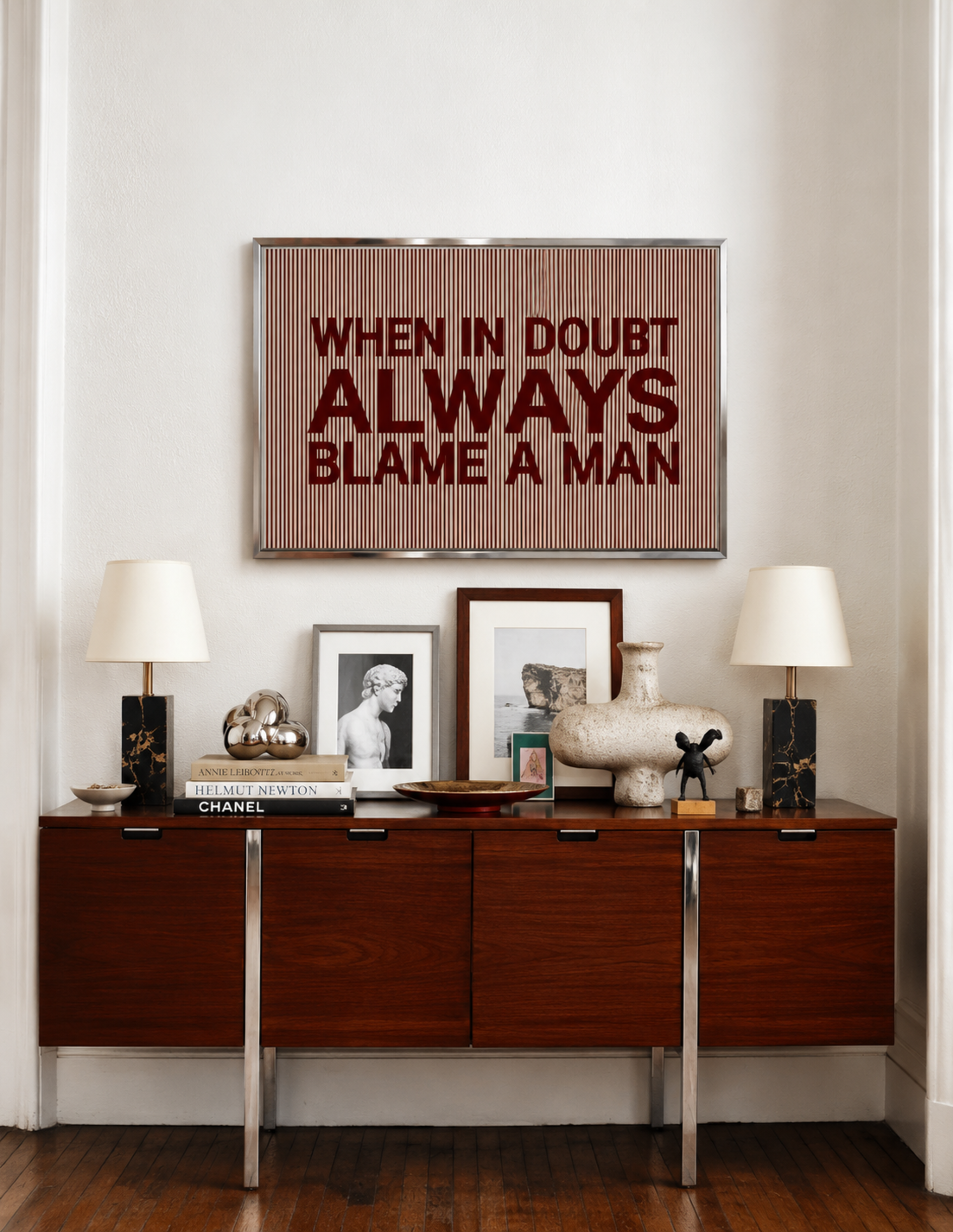 hand drawn Playful Funny typography print with the phrase "WHEN IN DOUBT ALWAYS BLAME A MAN" in a retro striped burgundy ruby canva. This is a trendy funny typography wall art print ideal for above bed, bedrooms, dorm room decor, living rooms and kitchens, gallery walls and playful interiors. The perfect Cool Girl Apartment decor