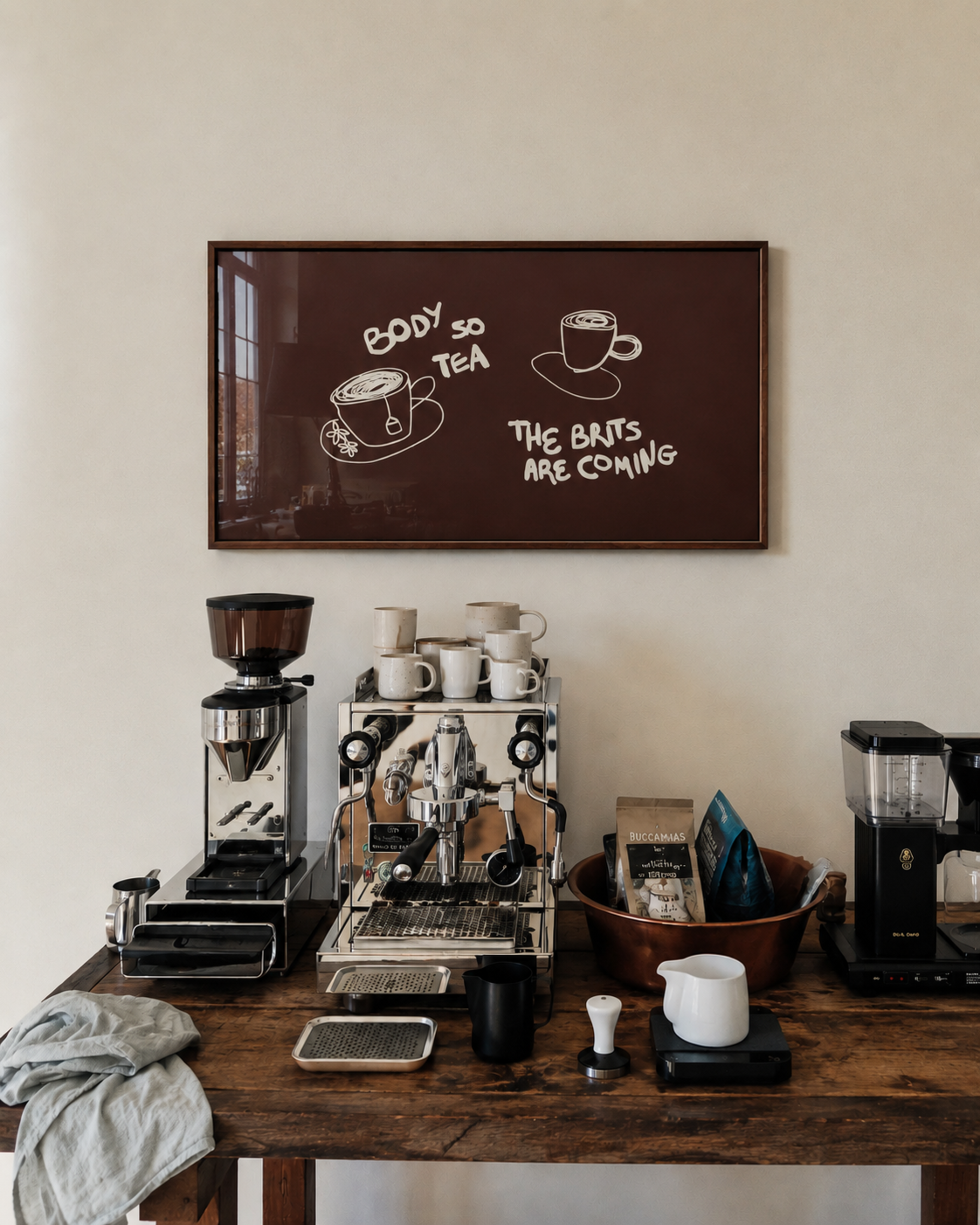 Body so tea the brits are coming is a humorous minimal typography wall art print, with two hand-drawn cups and playful whimsical handwritten lettering, adding charm, humour and effortless character to kitchens, breakfast nooks, dining spaces, coffee stations and tea corners, a conversation piece Inspired by café culture, slow mornings, blending contemporary minimalism with playful illustration