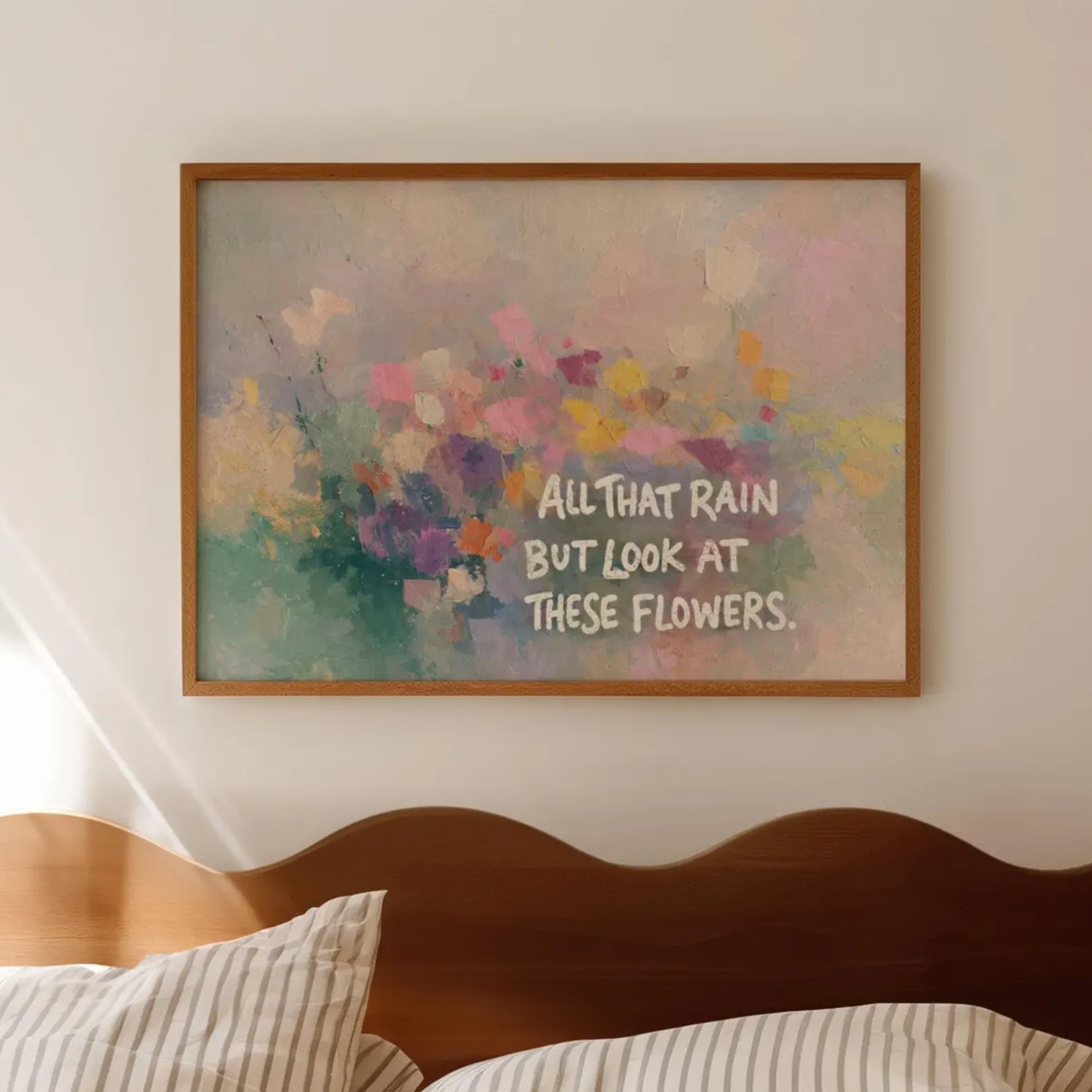 hand drawn Trendy typography abstract print with the motivational quote "ALL THAT RAIN BUT LOOK AT THESE FLOWERS" in a textured abstract painted canva with brush strokes in pink colors. This is a trendy minimal typography wall art print ideal for above bed, bedrooms, dorm room decor, living rooms and kitchens, gallery walls and playful interiors. The perfect Cool Girl Apartment decor