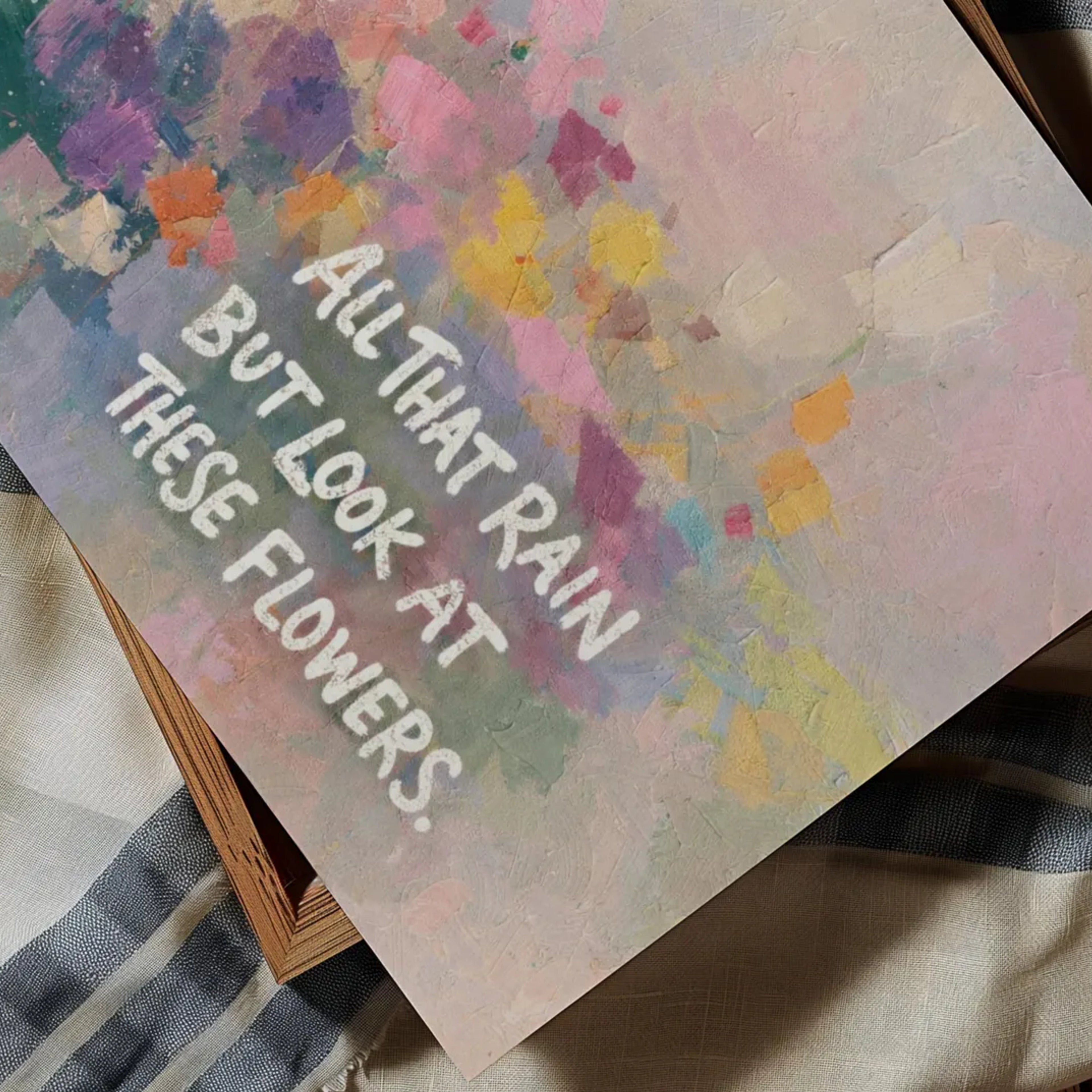 hand drawn Trendy typography abstract print with the motivational quote "ALL THAT RAIN BUT LOOK AT THESE FLOWERS" in a textured abstract painted canva with brush strokes in pink colors. This is a trendy minimal typography wall art print ideal for above bed, bedrooms, dorm room decor, living rooms and kitchens, gallery walls and playful interiors. The perfect Cool Girl Apartment decor