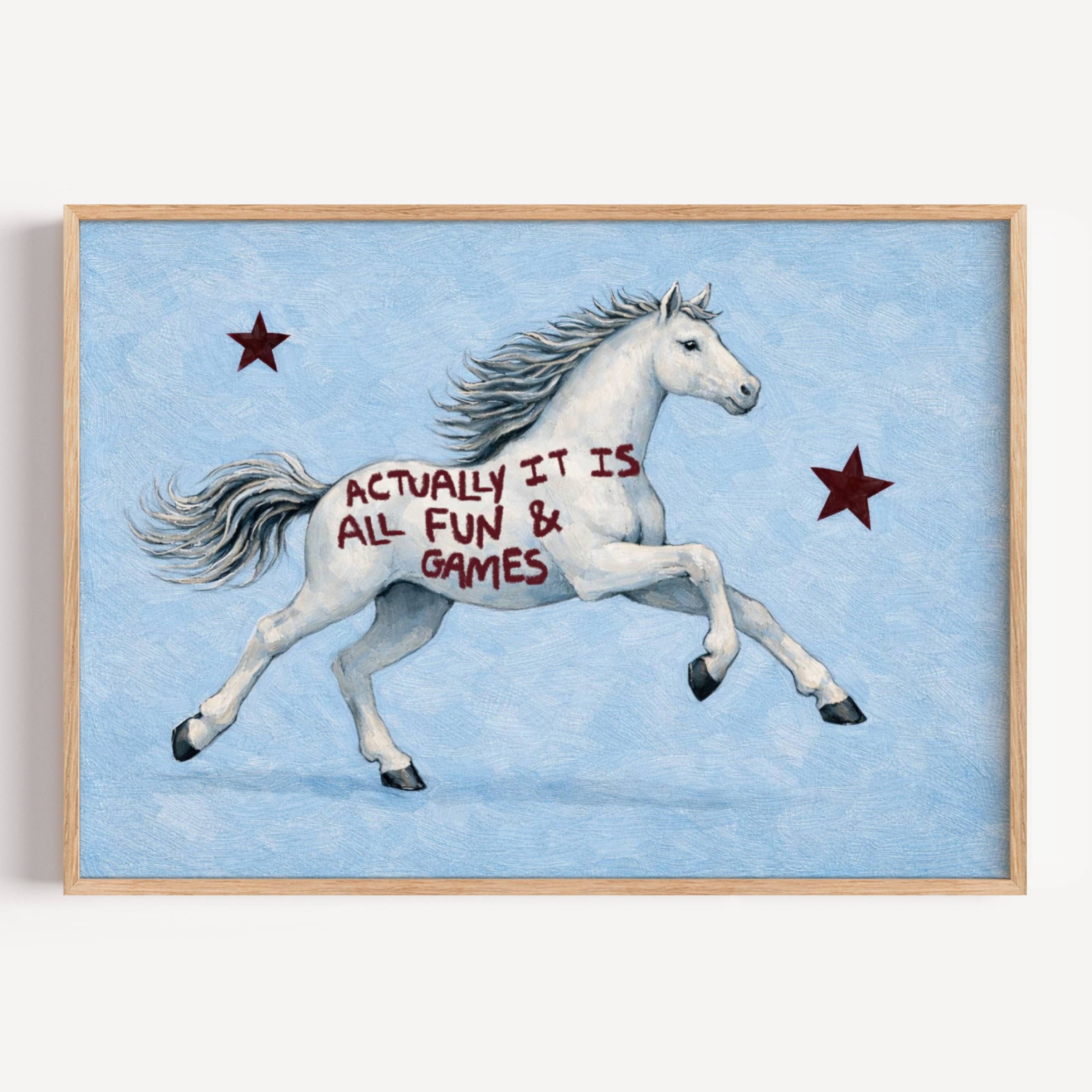 A surreal Symbolic artwork featuring a White Horse running against a pale blue background with Burgundy stars. The Horse has handwritten quote "Actually It Is All Fun and Games". This is a hand drawn Contemporary Folk art Print Oil Painting.