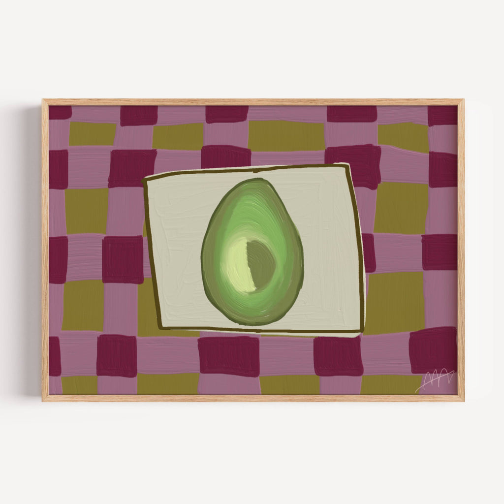 Playful Hand drawn Kitchen wall art with a still life avocado illustration on a pink purple and olive green checkerboard pattern background. This is a hand drawn Oil Painting kitchen and bar cart art Print decor for playful kitchens, dining spaces and eclectic interiors.