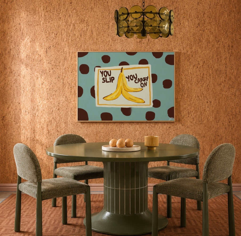 Funny Playful Hand drawn Kitchen wall art with a banana peel illustration and the phrase "You Slip You Carry On" on a blue polka dot background. This is a hand drawn Food Oil Painting kitchen and bar cart art Print decor for playful kitchens, dining spaces and eclectic interiors.