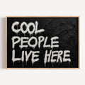 hand drawn Trendy typography print in grafitti style with the quote "COOL PEOPLE LIVE HERE" in a textured Black canva. This is a trendy minimalist typography wall art print ideal for above bed, bedrooms, dorm room decor, living rooms and kitchens, gallery walls and playful interiors. The perfect Cool Girl Apartment decor