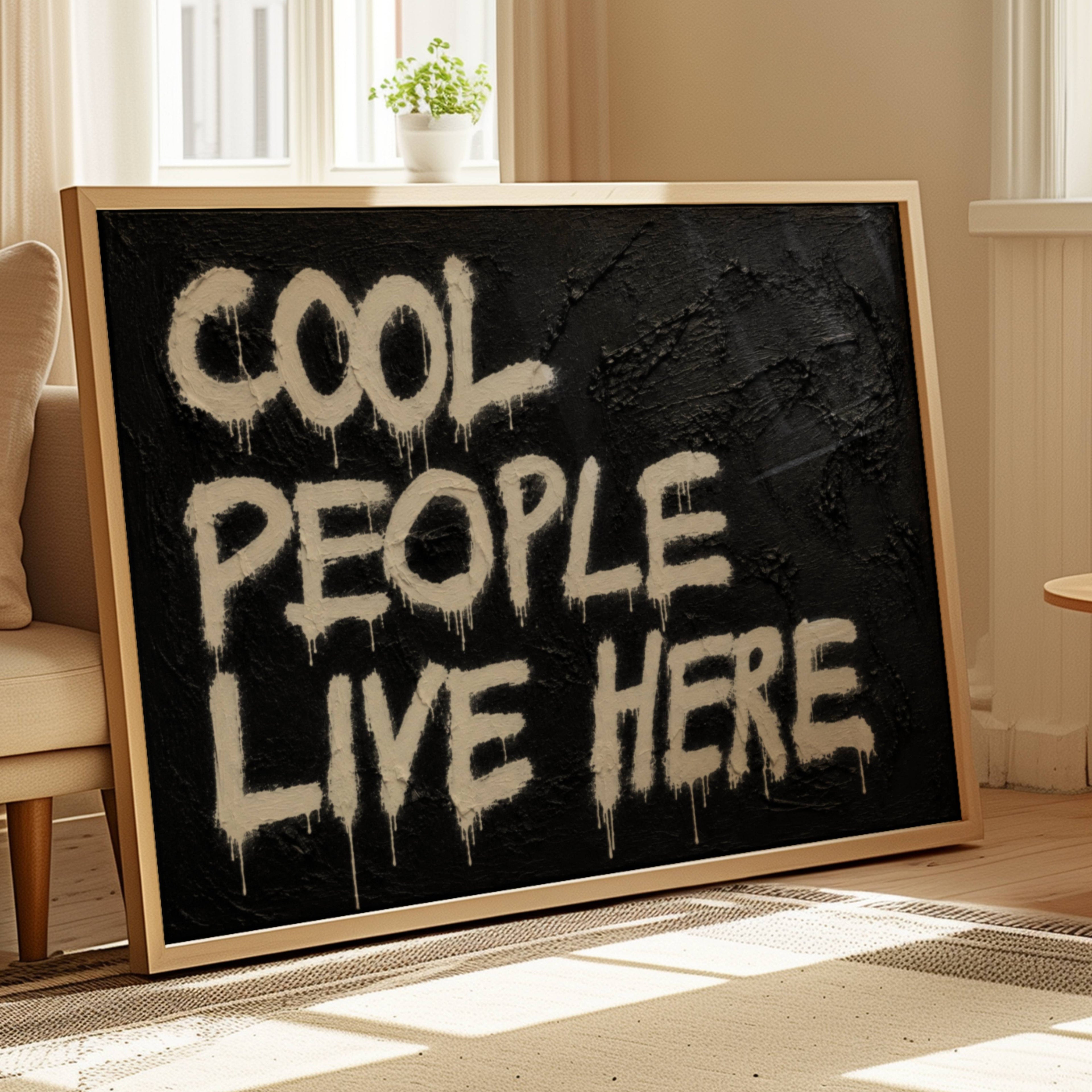 hand drawn Trendy typography print in grafitti style with the quote "COOL PEOPLE LIVE HERE" in a textured Black canva. This is a trendy minimalist typography wall art print ideal for above bed, bedrooms, dorm room decor, living rooms and kitchens, gallery walls and playful interiors. The perfect Cool Girl Apartment decor