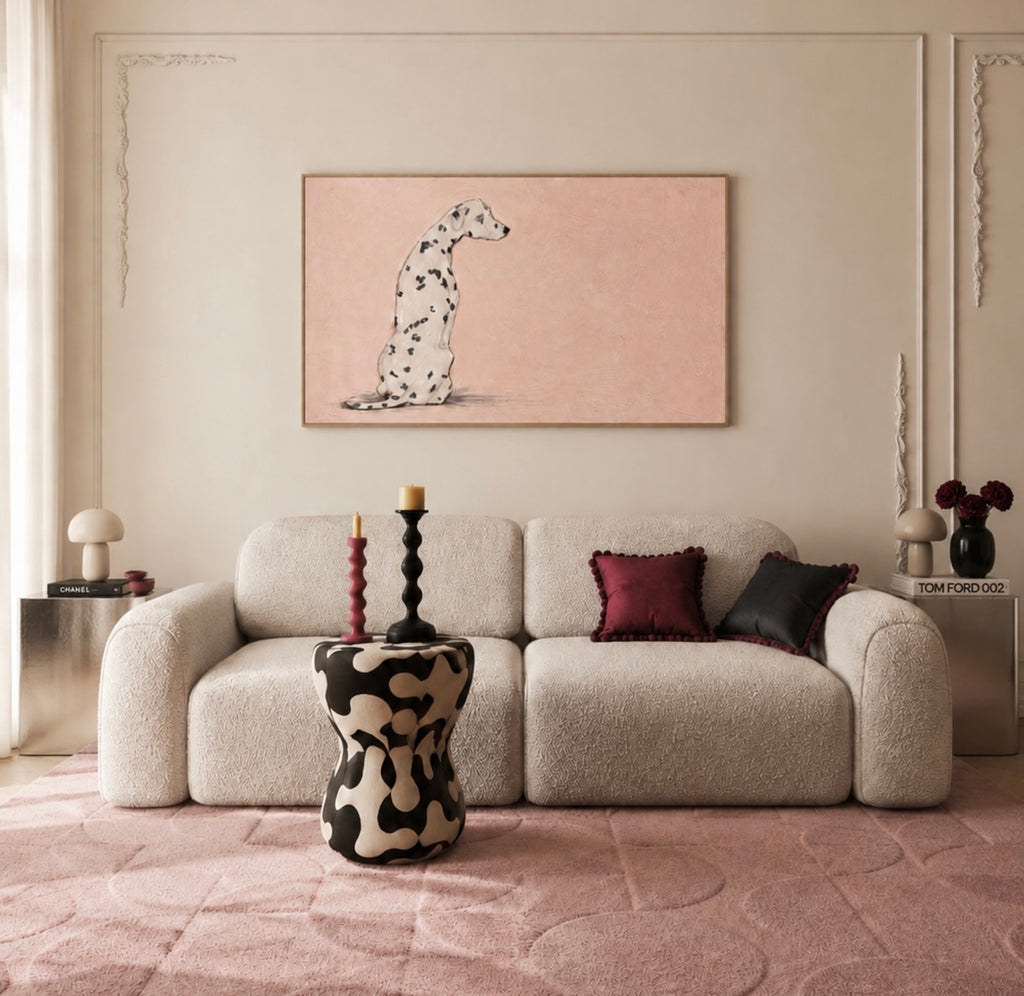 the spotty one is a hand painted Minimalist Contemporary wall art print of a dalmatian dog sitting against a pink background, inspired by quiet luxury interiors with expressive painterly texture. Minimalist Mid century modern dalmatian dog oil painting in cinematic nostalgia composition.