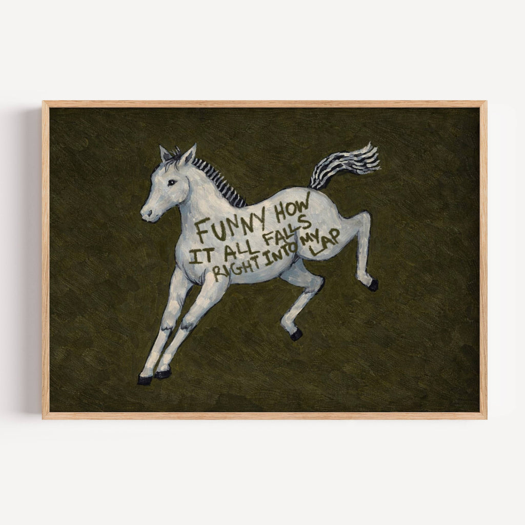 A surreal Symbolic artwork featuring a White Horse running against a deep khaki green background. The Horse has handwritten quote "Funny How It All Falls Right Into my Lap". This is a hand drawn Contemporary Folk art Print Oil Painting.