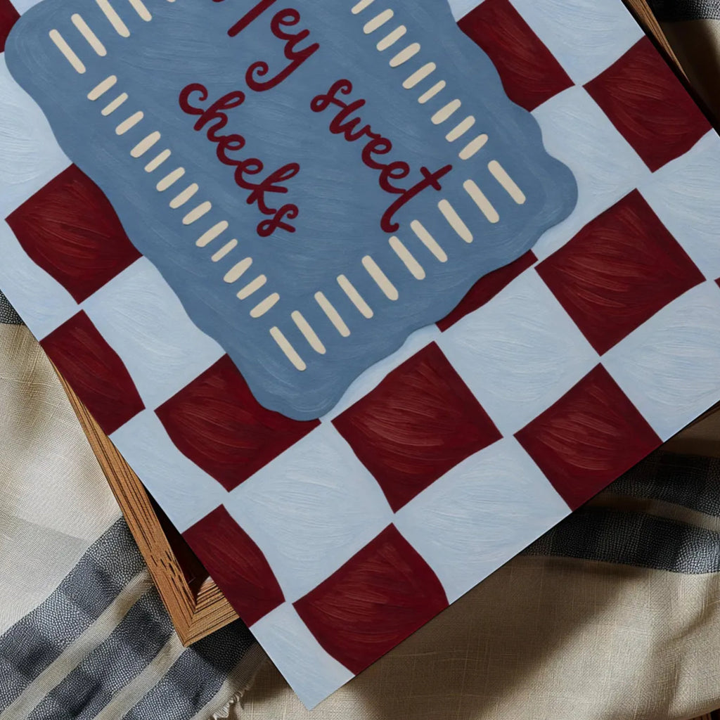 HEY SWEET CHEEKS is a whimsical Retro typography art print designed to bring humour, colour and personality into your bathroom and laundry room. Featuring vintage-inspired Checkered patterns and hand-lettered typography, this artwork captures the nostalgic charm while adding a playful decorative touch to modern interiors. this is a hand drawn Retro quote wall art, ideal for bathrooms, laundry room decor, and cheeky playful interiors. blue burgundy