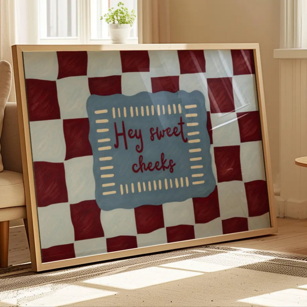 HEY SWEET CHEEKS is a whimsical Retro typography art print designed to bring humour, colour and personality into your bathroom and laundry room. Featuring vintage-inspired Checkered patterns and hand-lettered typography, this artwork captures the nostalgic charm while adding a playful decorative touch to modern interiors. this is a hand drawn Retro quote wall art, ideal for bathrooms, laundry room decor, and cheeky playful interiors. blue burgundy