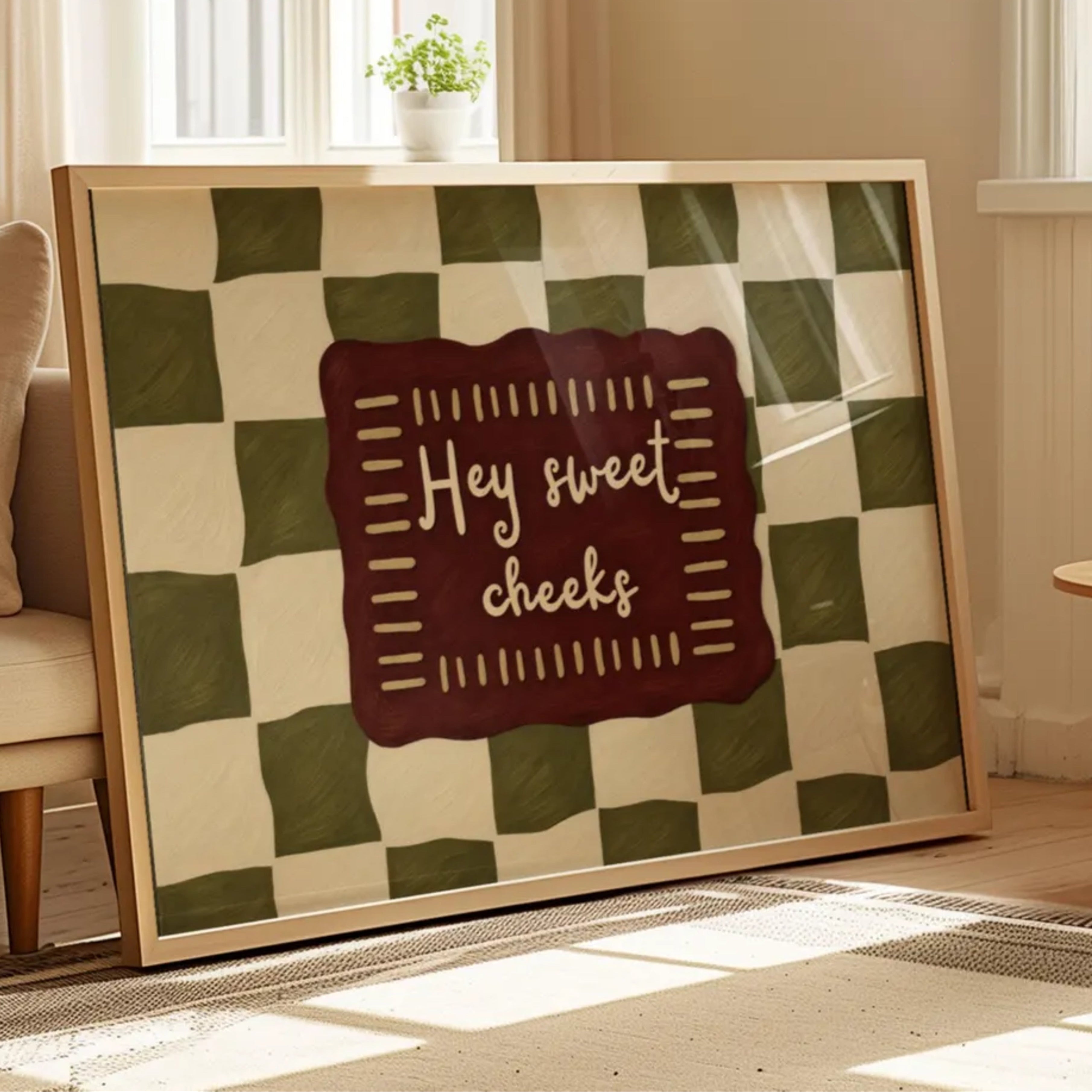 HEY SWEET CHEEKS is a whimsical Retro typography art print designed to bring humour, colour and personality into your bathroom and laundry room. Featuring vintage-inspired Checkered patterns and hand-lettered typography, this artwork captures the nostalgic charm while adding a playful decorative touch to modern interiors. this is a hand drawn Retro quote wall art, ideal for bathrooms, laundry room decor, and cheeky playful interiors. khaki burgundy