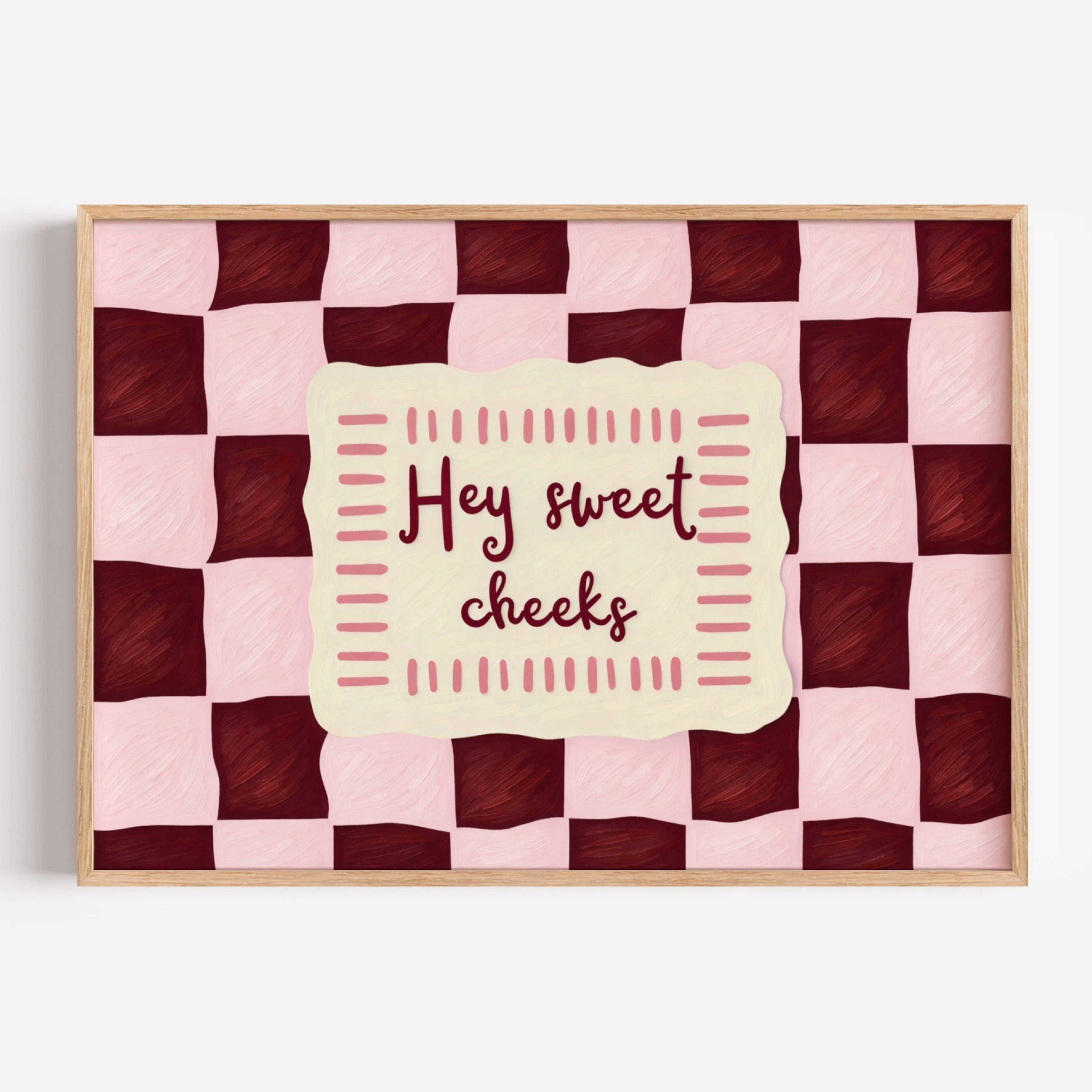 HEY SWEET CHEEKS is a whimsical Retro typography art print designed to bring humour, colour and personality into your bathroom and laundry room. Featuring vintage-inspired Checkered patterns and hand-lettered typography, this artwork captures the nostalgic charm while adding a playful decorative touch to modern interiors. this is a hand drawn Retro quote wall art, ideal for bathrooms, laundry room decor, and cheeky playful interiors. pink burgundy