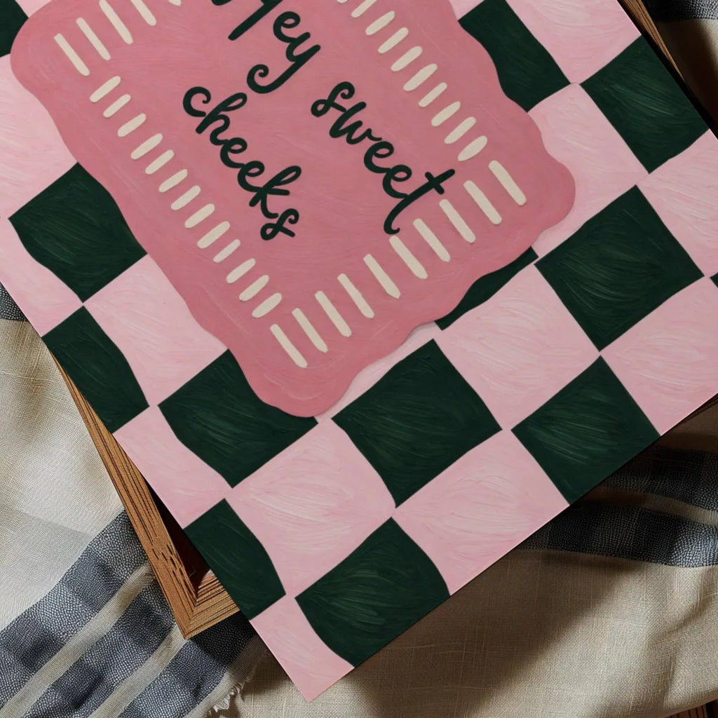 HEY SWEET CHEEKS is a whimsical Retro typography art print designed to bring humour, colour and personality into your bathroom and laundry room. Featuring vintage-inspired Checkered patterns and hand-lettered typography, this artwork captures the nostalgic charm while adding a playful decorative touch to modern interiors. this is a hand drawn Retro quote wall art, ideal for bathrooms, laundry room decor, and cheeky playful interiors. pink green