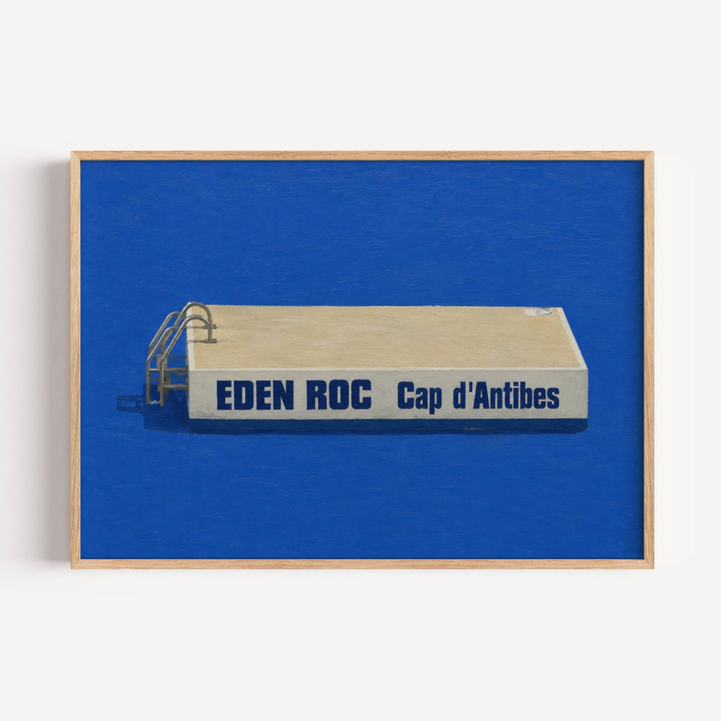 Inspired by the iconic diving platform at Hôtel du Cap-Eden-Roc, this artwork captures the quiet luxury and timeless elegance of the French Riviera. The striking contrast between the crisp architectural form and the endless Mediterranean blue transforms a familiar landmark into a minimalist statement piece.
Eden Roc celebrates slow summers, saltwater mornings and the understated glamour of the Côte d’Azur. Its clean composition and rich cobalt palette make it equally suited to modern interiors, coastal home
