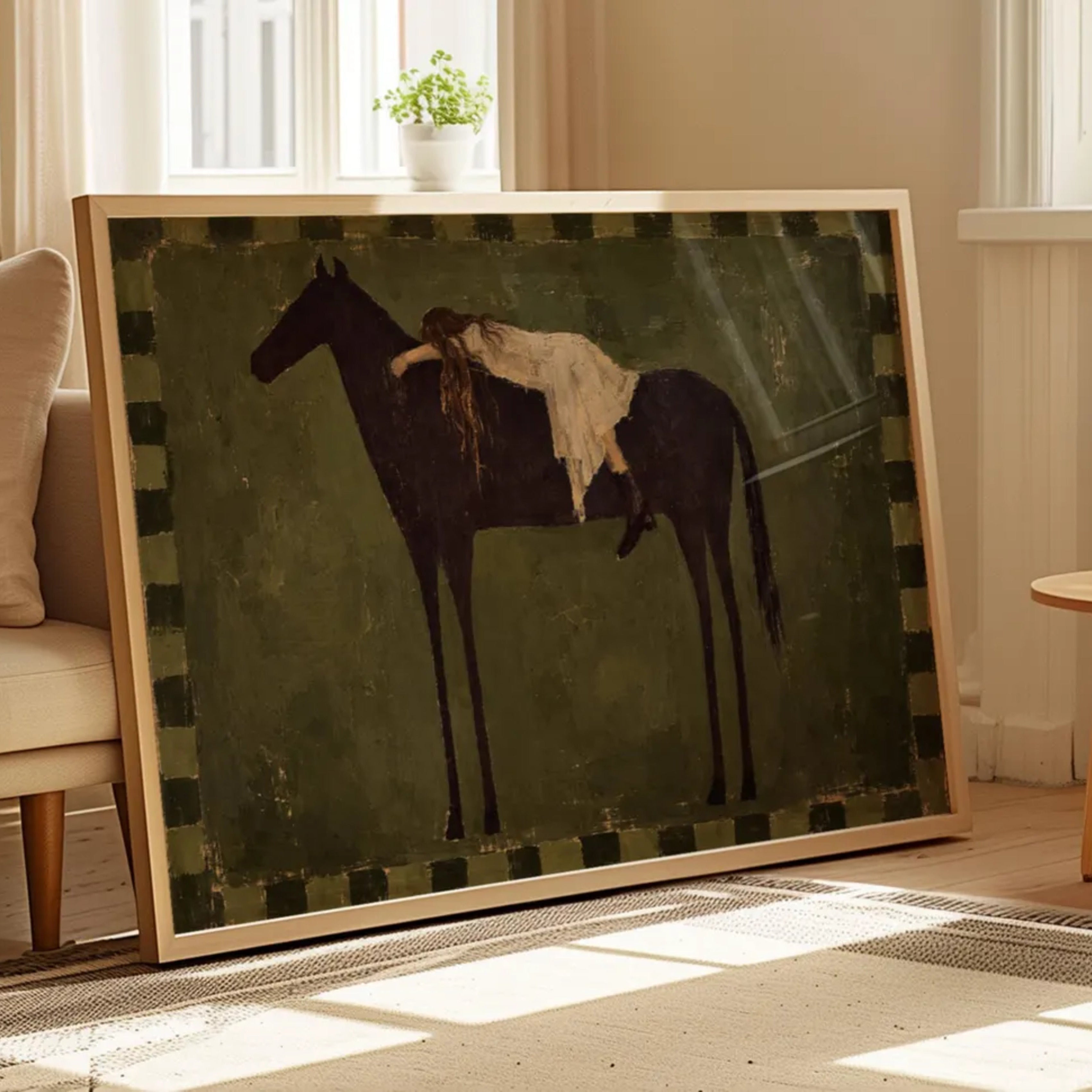 Held by the Horse is a symbolic Western Horse Artwork featuring a restiing female figure on a dark horse in Earthy khaki tones