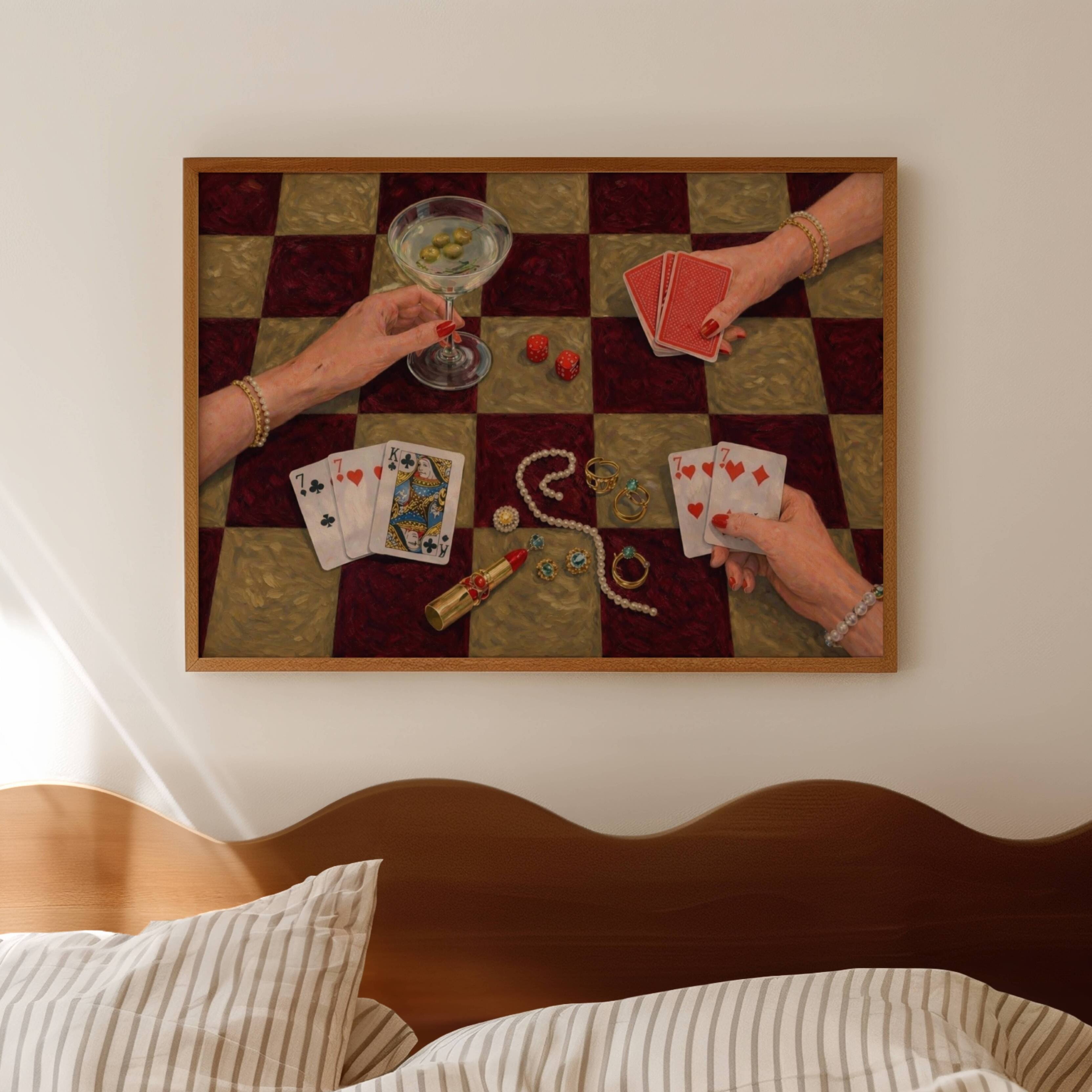 House always wins is a hand painted wall art print featuring a still life table with hands playing card games, in checkerboard khaki and burgundy tones, inspired by Poker Night Casino aesthetic, Martinis and feminine rituals, celebrating poker, pearls and playful luxury. Horizontal poker night casino still life table oil painting wall art print