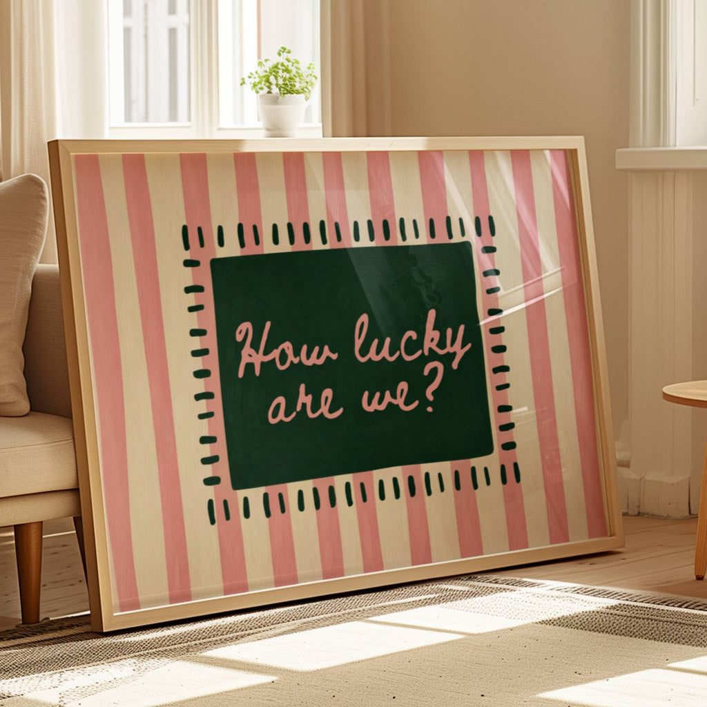hand drawn Playful typography print with the phrase "How Lucky Are We?" on a pink striped background. This is a hand drawn trendy typography wall art print ideal for bedrooms, dorm room decor, gallery walls and playful interiors.