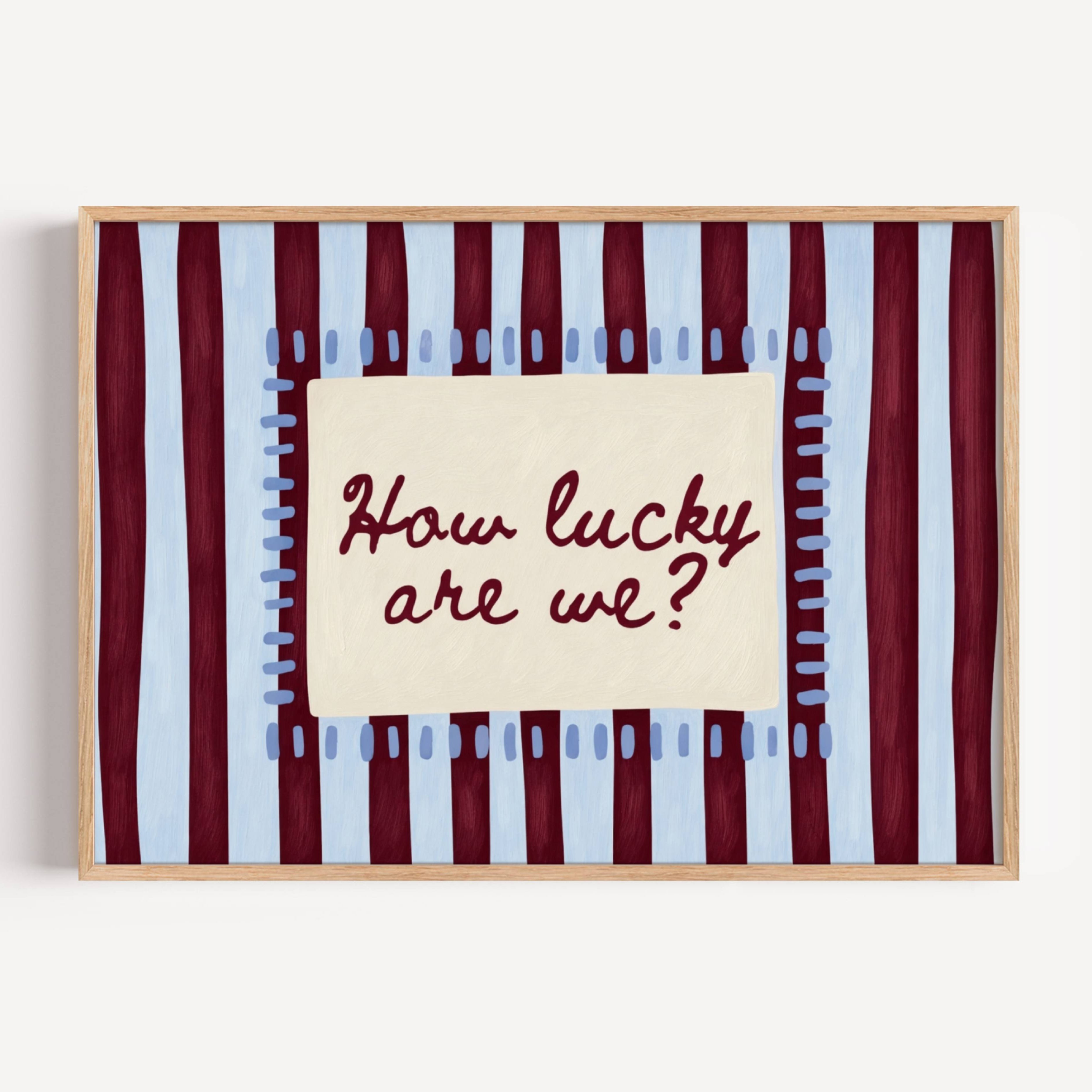 hand drawn Playful typography print with the phrase "How Lucky Are We?" on a blue and ruby burgundy striped background. This is a hand drawn trendy typography wall art print ideal for bedrooms, dorm room decor, gallery walls and playful interiors.
