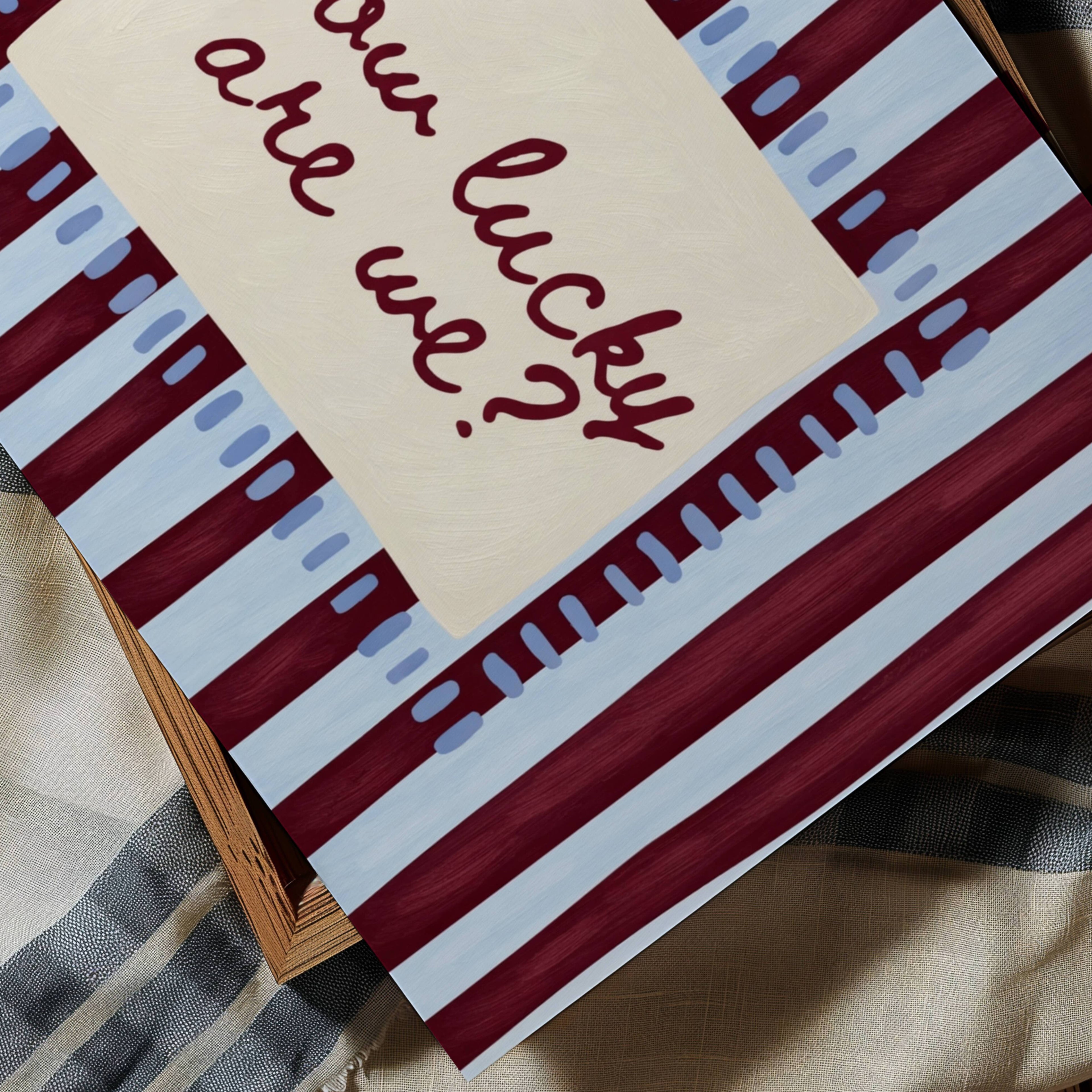 hand drawn Playful typography print with the phrase "How Lucky Are We?" on a blue and ruby burgundy striped background. This is a hand drawn trendy typography wall art print ideal for bedrooms, dorm room decor, gallery walls and playful interiors.