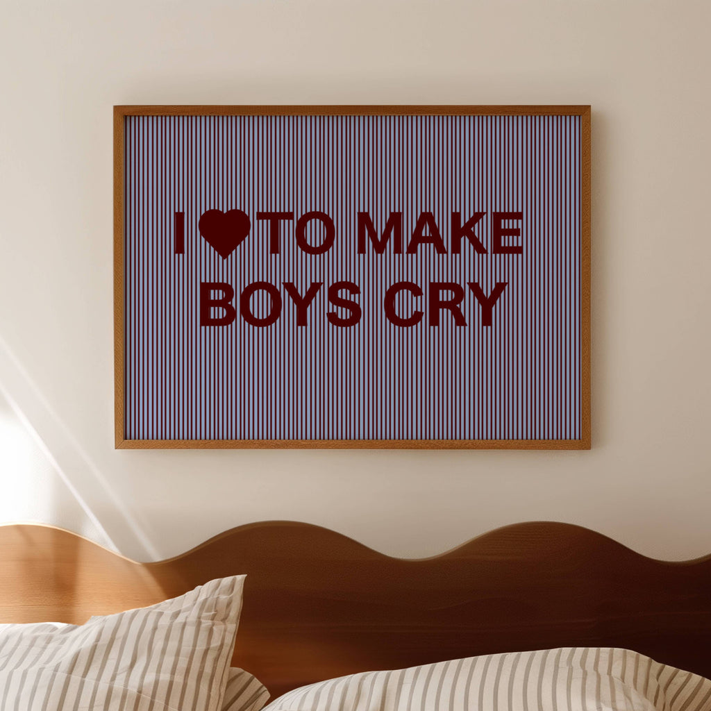 hand drawn Playful Funny typography print with the phrase "I LOVE TO MAKE BOYS CRY" in a retro striped blue and ruby canva. This is a trendy funny typography wall art print ideal for above bed, bedrooms, dorm room decor, living rooms and kitchens, gallery walls and playful interiors. The perfect Cool Girl Apartment decor