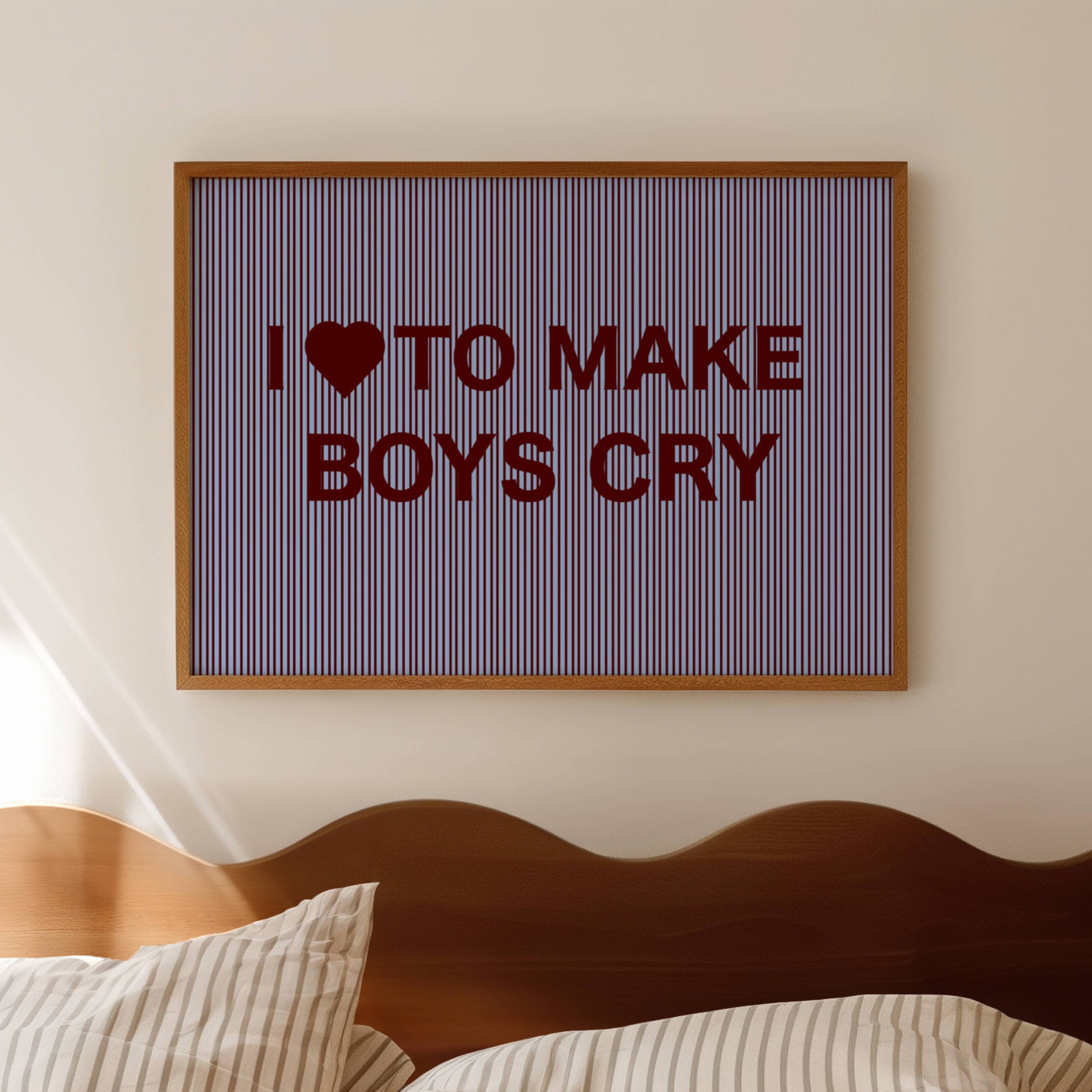 hand drawn Playful Funny typography print with the phrase "I LOVE TO MAKE BOYS CRY" in a retro striped blue and ruby canva. This is a trendy funny typography wall art print ideal for above bed, bedrooms, dorm room decor, living rooms and kitchens, gallery walls and playful interiors. The perfect Cool Girl Apartment decor
