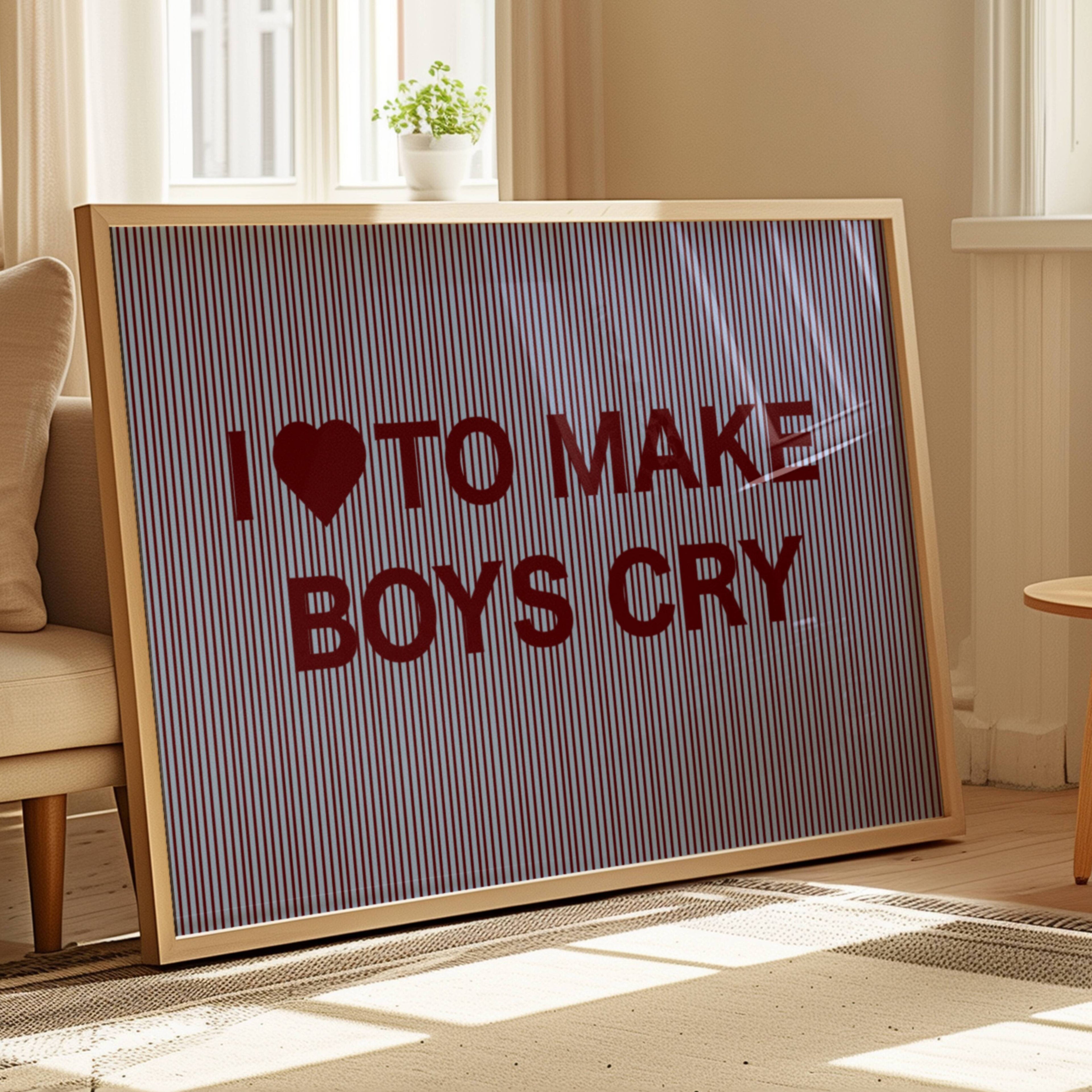 hand drawn Playful Funny typography print with the phrase "I LOVE TO MAKE BOYS CRY" in a retro striped blue and ruby canva. This is a trendy funny typography wall art print ideal for above bed, bedrooms, dorm room decor, living rooms and kitchens, gallery walls and playful interiors. The perfect Cool Girl Apartment decor
