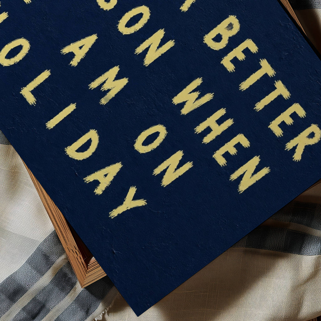 I am a better person when im on holiday is a Hand-painted typography against a dark blue background, creating a bold contrast that feels nostalgic, playful contemporary. a design statement, this artwork celebrates fleeting summers, beautiful memories and the places we carry long after we’ve left them. this piece brings warmth, humour and personality into a space. It works beautifully in bedrooms, holiday homes, creative studios and eclectic gallery walls where art tells a story rather than simply filling a 