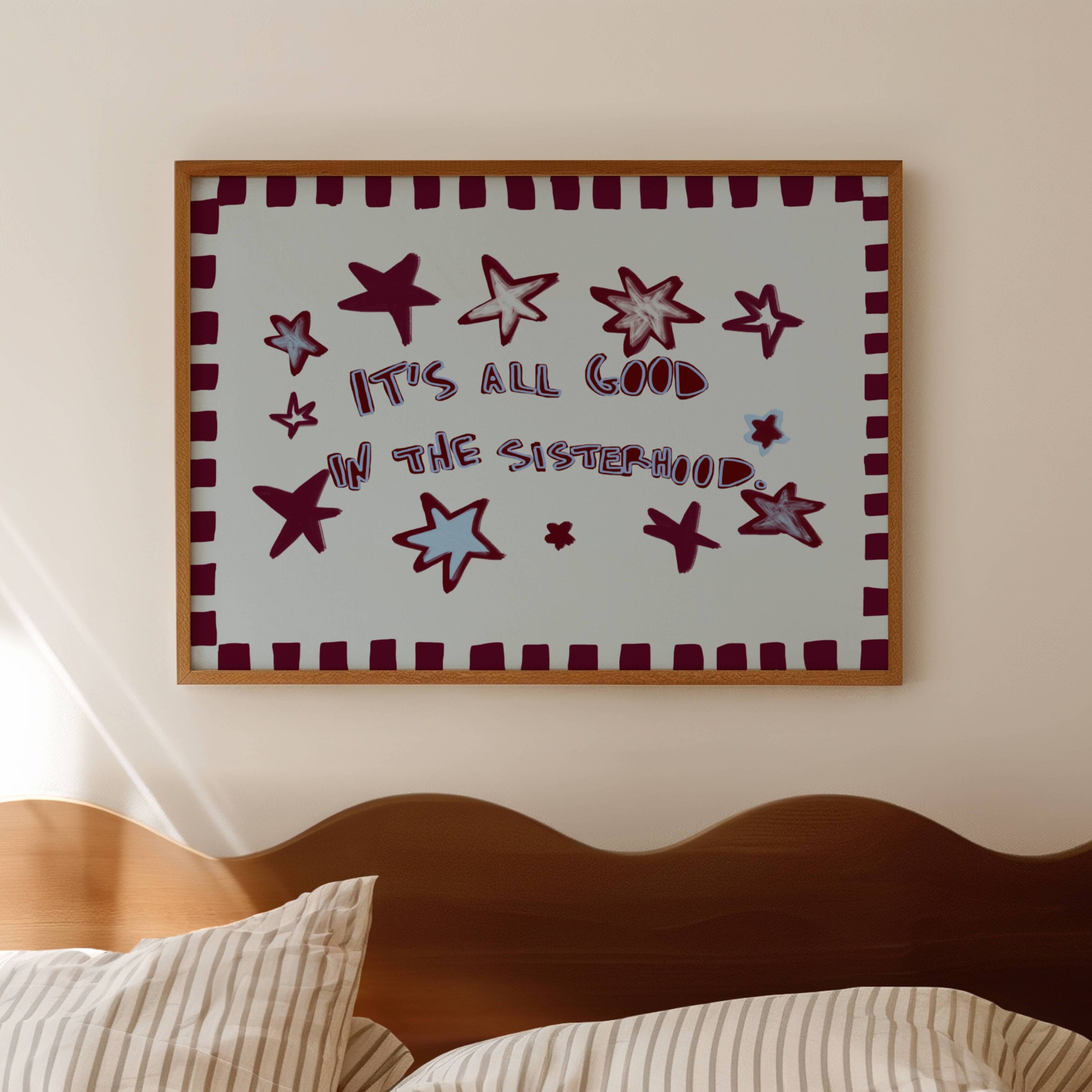 Playful typography print with the phrase "It's all good in the sisterhood" on a blue background with burgundy stars. This is a hand drawn trendy typography wall art print ideal for girly bedrooms, dorm room decor, sorority houses and gift for your best friend.