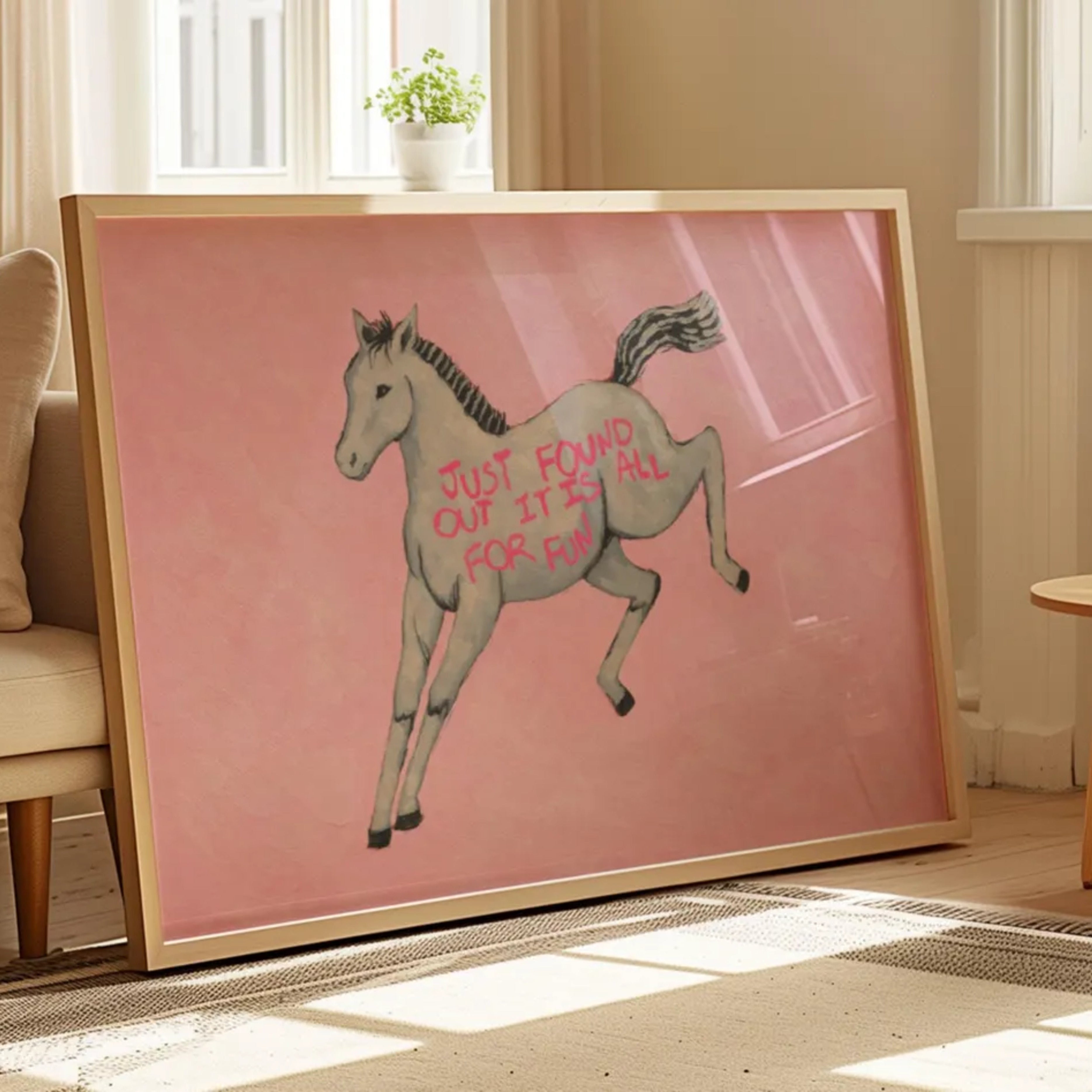 A surreal Symbolic artwork featuring a White Horse running against a pink background. The Horse has handwritten quote "Just Found Out It Is All For Fun". This is a hand drawn Eclectic Contemporary Folk art Print Oil Painting.