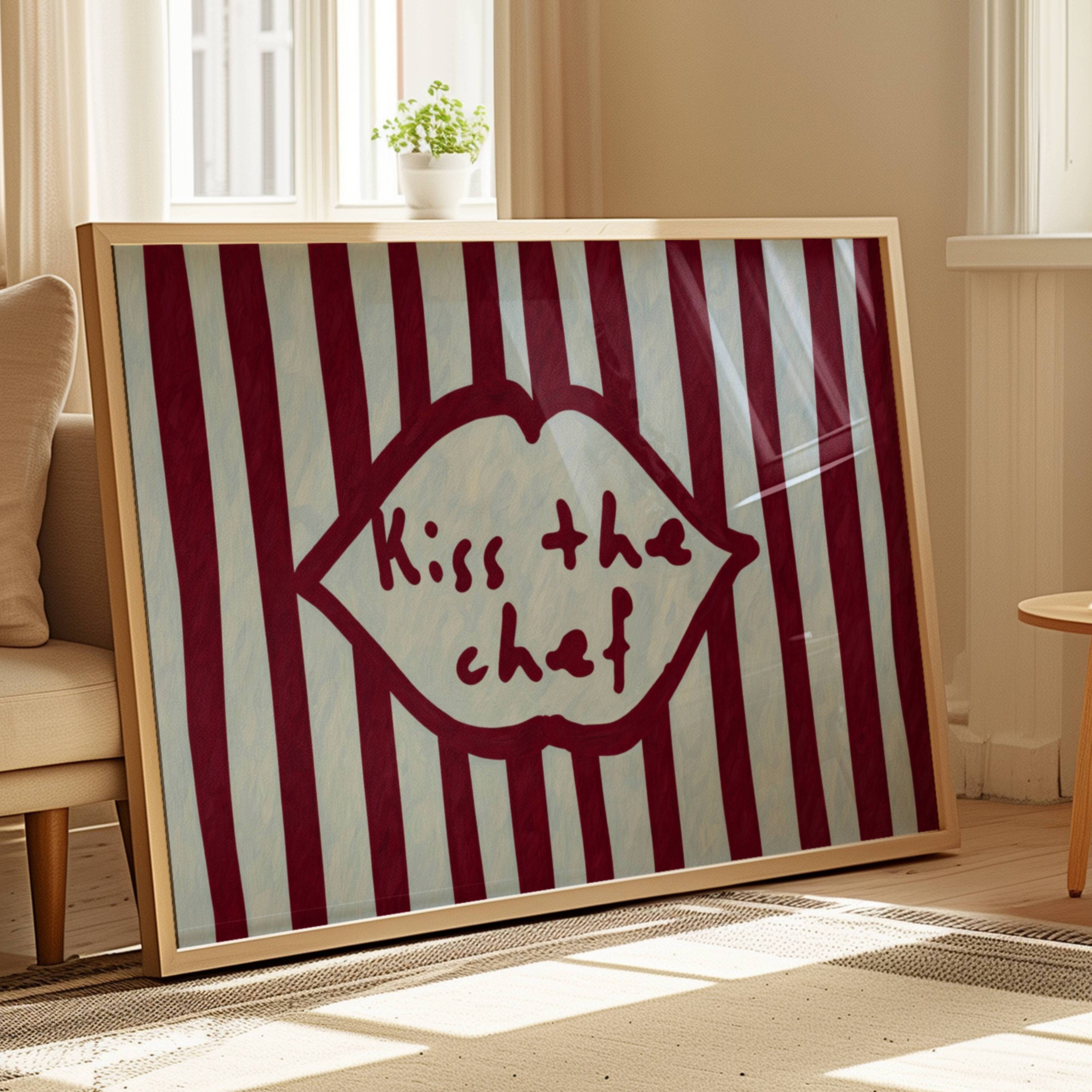Playful Kitchen Funny Typography wall art with Handwritten quote "Kiss the chef" on a retro striped background in ruby blue tones with lips motif. This is a hand drawn Oil Painting kitchen art Print decor.