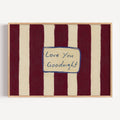 hand drawn Playful typography print with the phrase "Love You Goodnight" on a retro burgundy striped background, on textured oil painting canva. This is a hand drawn trendy typography wall art print ideal for bedrooms, dorm room decor, gallery walls and playful interiors.