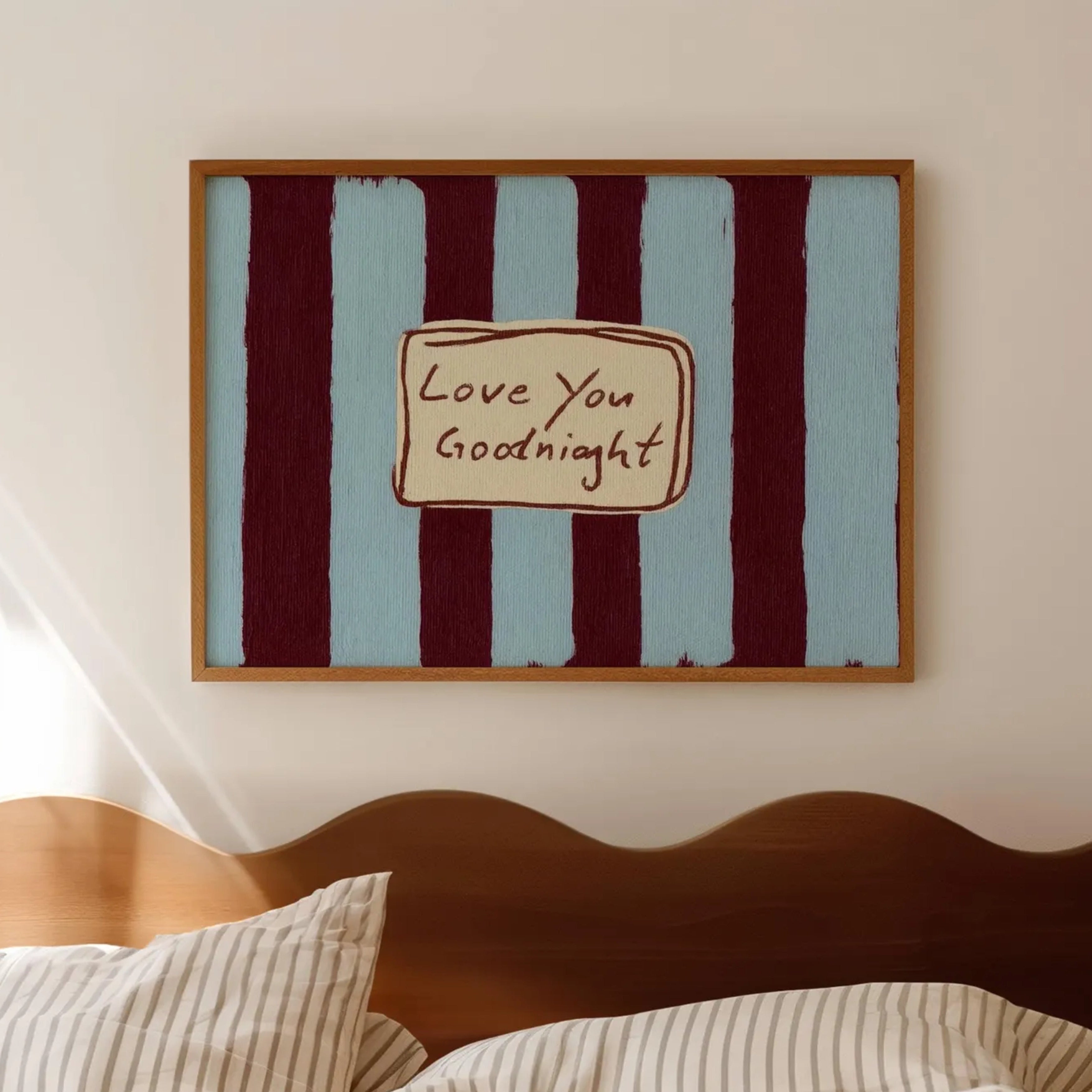 hand drawn Playful typography print with the phrase "Love You Goodnight" on a retro blue and burgundy striped background, on textured oil painting canva. This is a hand drawn trendy typography wall art print ideal for bedrooms, dorm room decor, gallery walls and playful interiors.