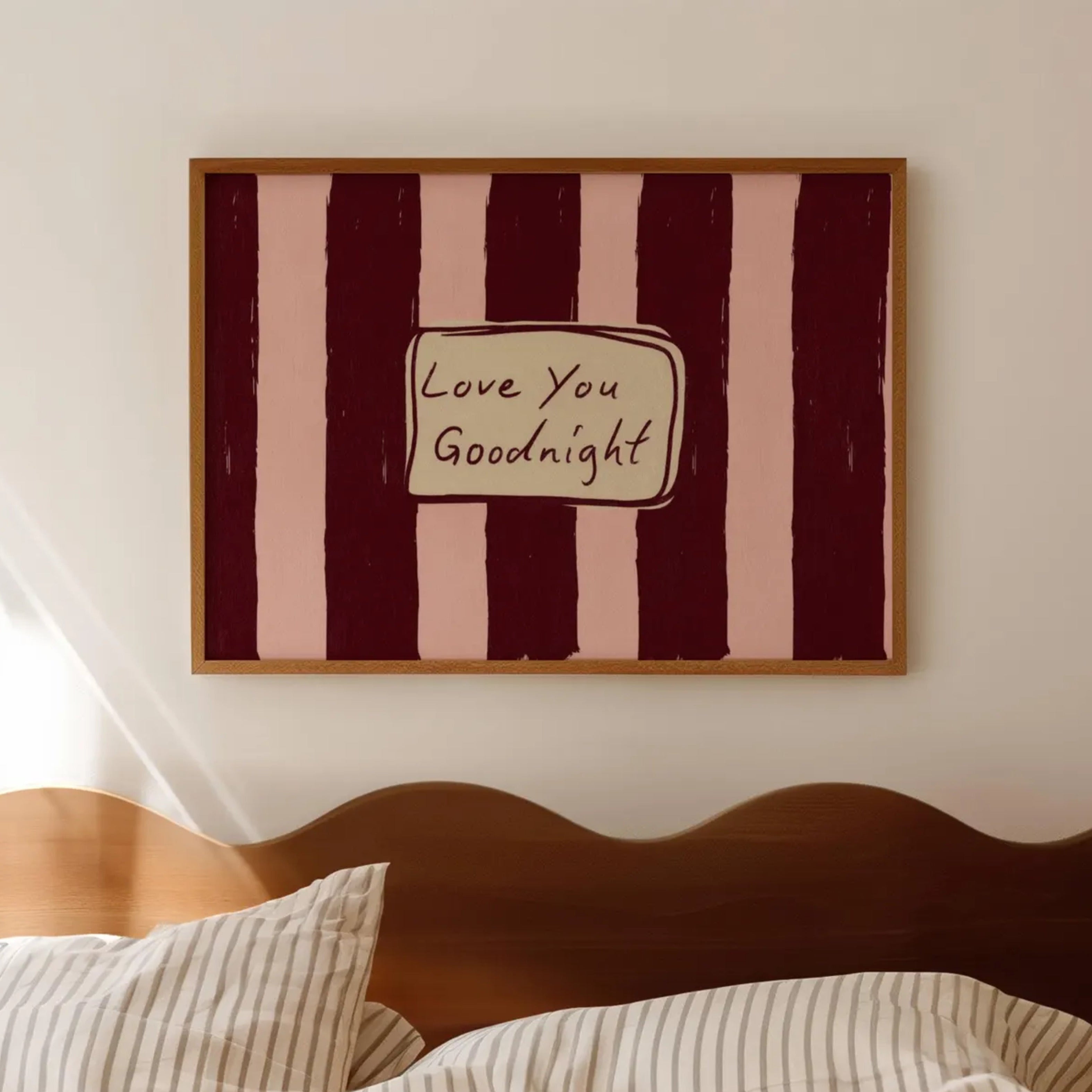 hand drawn Playful typography print with the phrase "Love You Goodnight" on a retro burgundy and pink striped background, on textured oil painting canva. This is a hand drawn trendy typography wall art print ideal for bedrooms, dorm room decor, gallery walls and playful interiors.