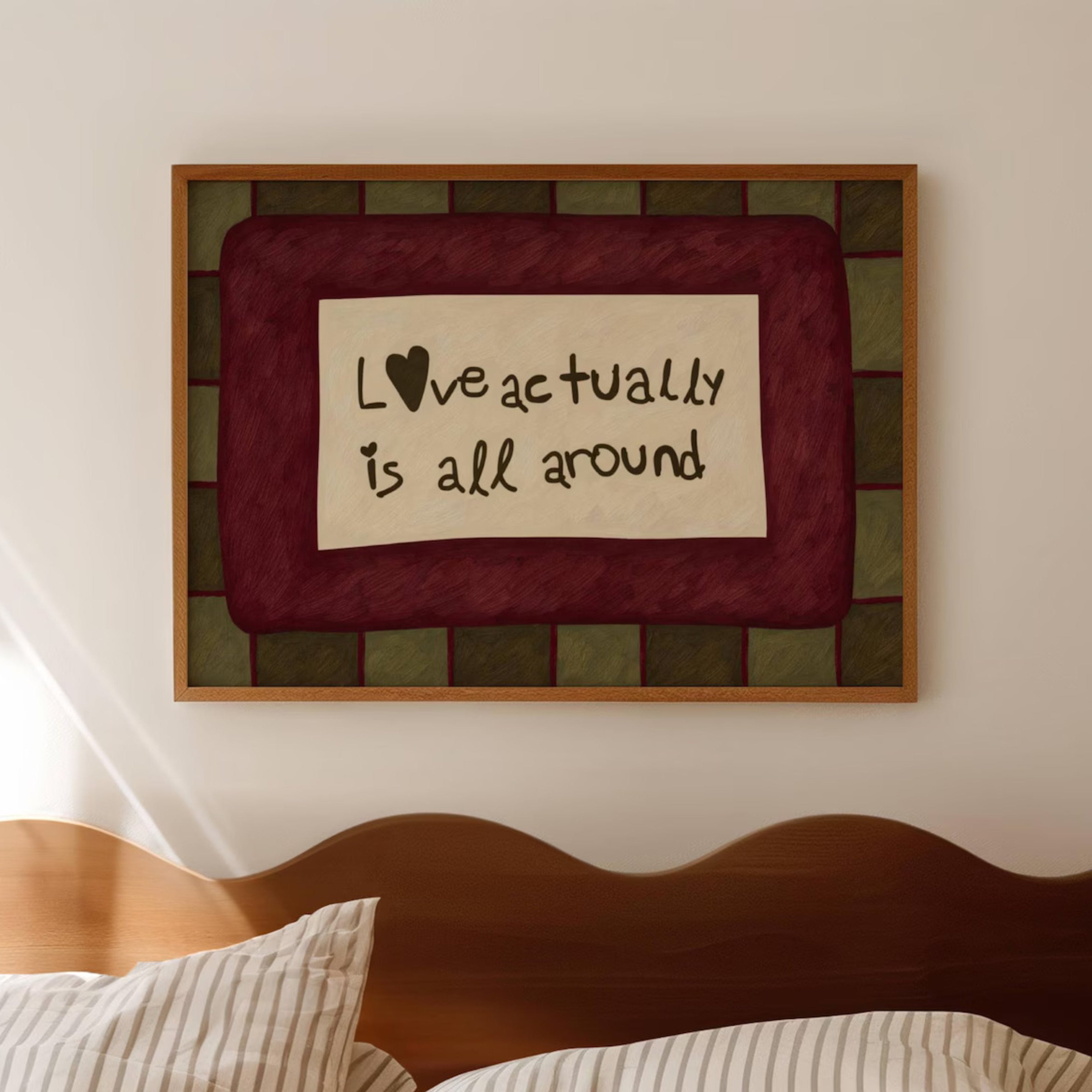 hand drawn Playful typography print with the phrase "Love actually is all around" in a retro khaki and ruby burgundy, on textured oil painting canva. This is a hand drawn trendy romantic typography wall art print ideal for above bed, bedrooms, dorm room decor, living rooms and kitchens, gallery walls and playful interiors.