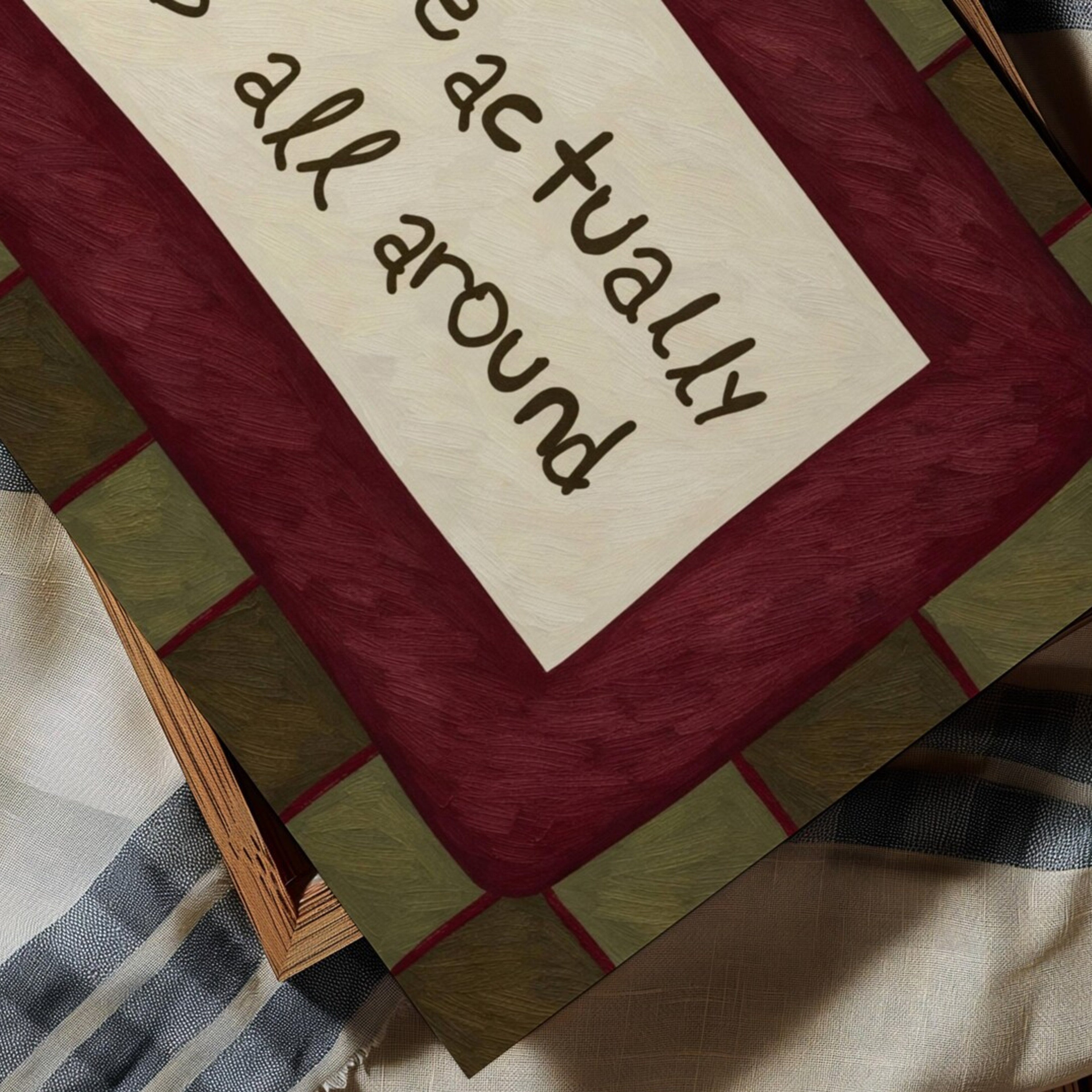 hand drawn Playful typography print with the phrase "Love actually is all around" in a retro khaki and ruby burgundy, on textured oil painting canva. This is a hand drawn trendy romantic typography wall art print ideal for above bed, bedrooms, dorm room decor, living rooms and kitchens, gallery walls and playful interiors.