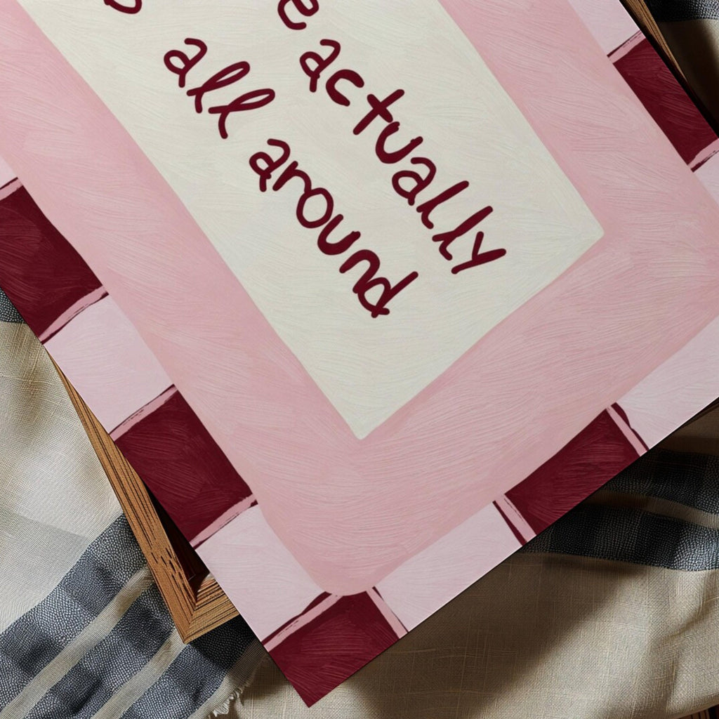 hand drawn Playful typography print with the phrase "Love actually is all around" in a retro pink and ruby burgundy, on textured oil painting canva. This is a hand drawn trendy romantic typography wall art print ideal for above bed, bedrooms, dorm room decor, living rooms and kitchens, gallery walls and playful interiors.