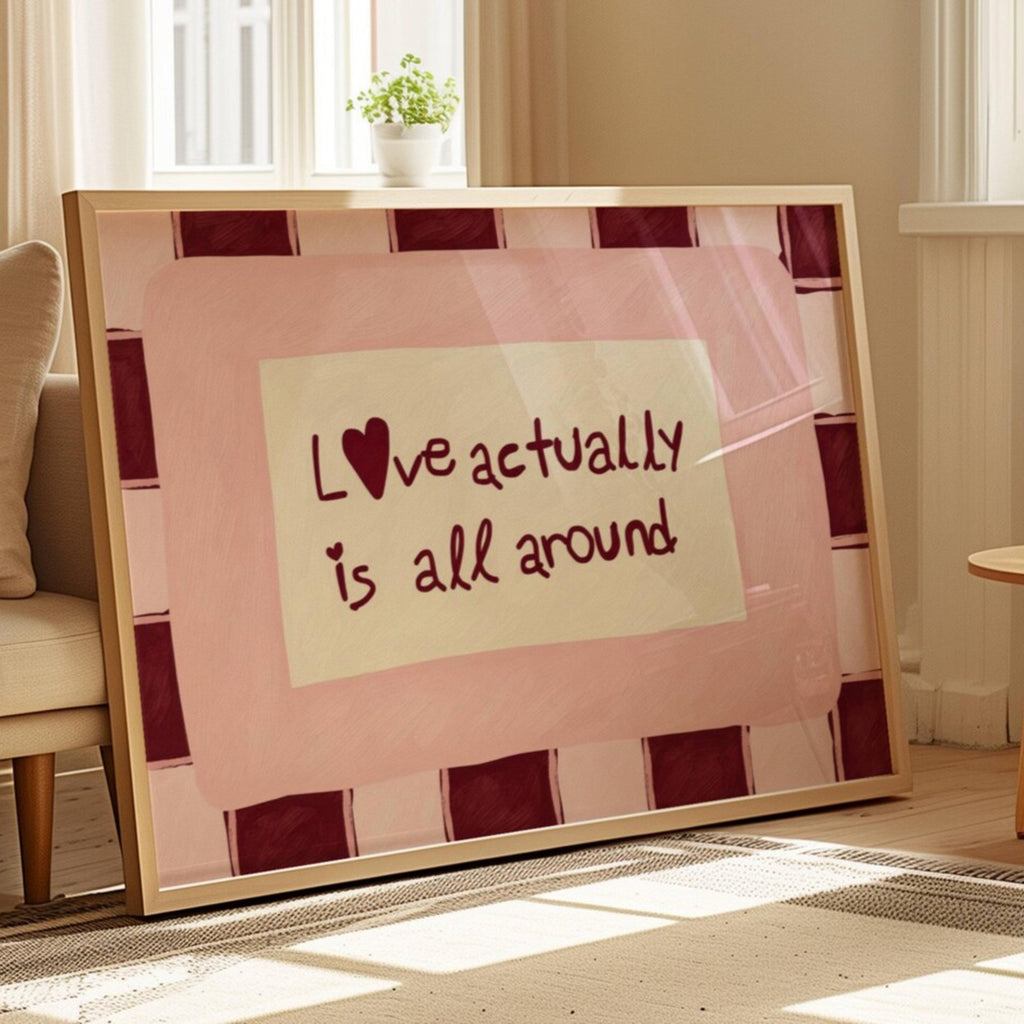 hand drawn Playful typography print with the phrase "Love actually is all around" in a retro pink and ruby burgundy, on textured oil painting canva. This is a hand drawn trendy romantic typography wall art print ideal for above bed, bedrooms, dorm room decor, living rooms and kitchens, gallery walls and playful interiors.