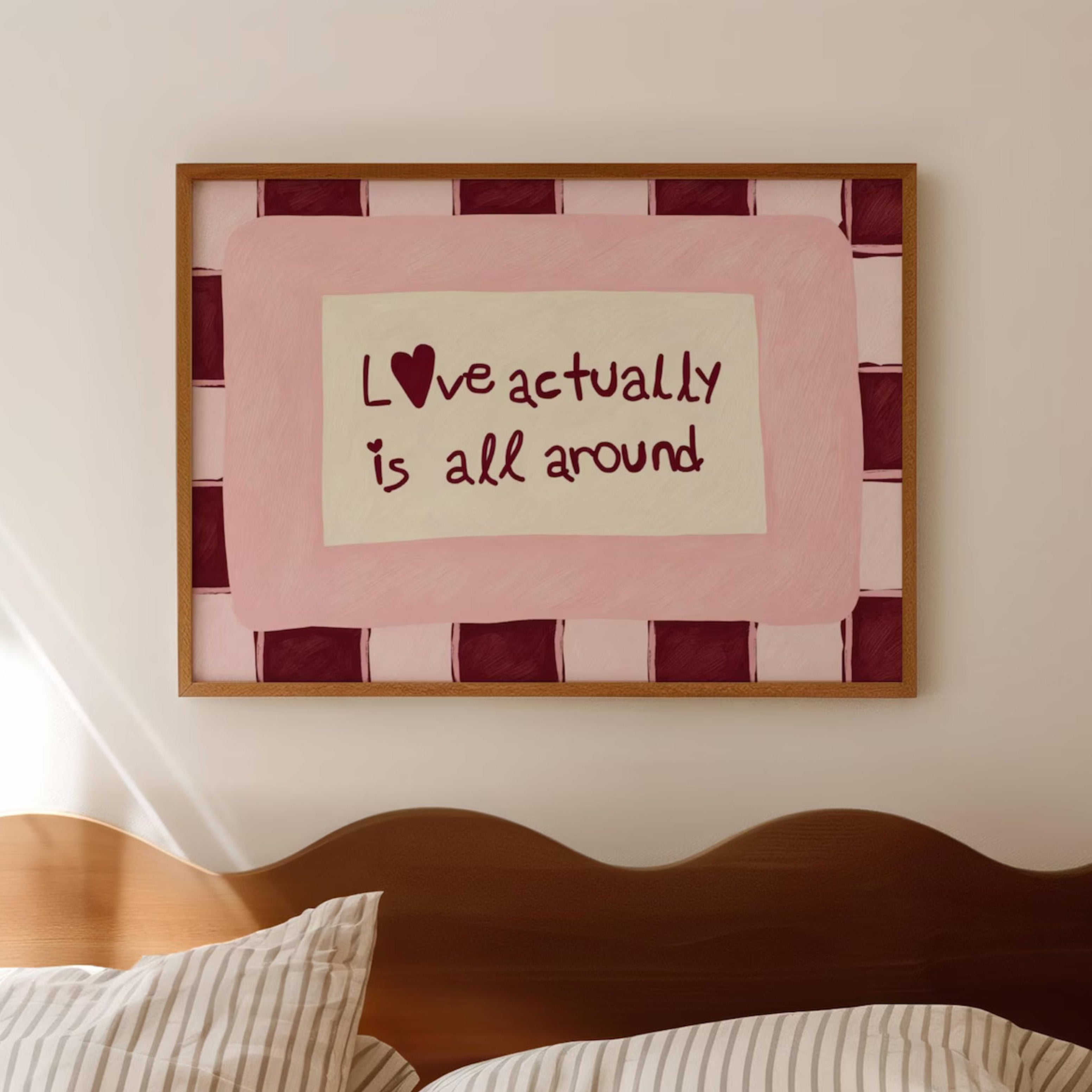 hand drawn Playful typography print with the phrase "Love actually is all around" in a retro pink and ruby burgundy, on textured oil painting canva. This is a hand drawn trendy romantic typography wall art print ideal for above bed, bedrooms, dorm room decor, living rooms and kitchens, gallery walls and playful interiors.