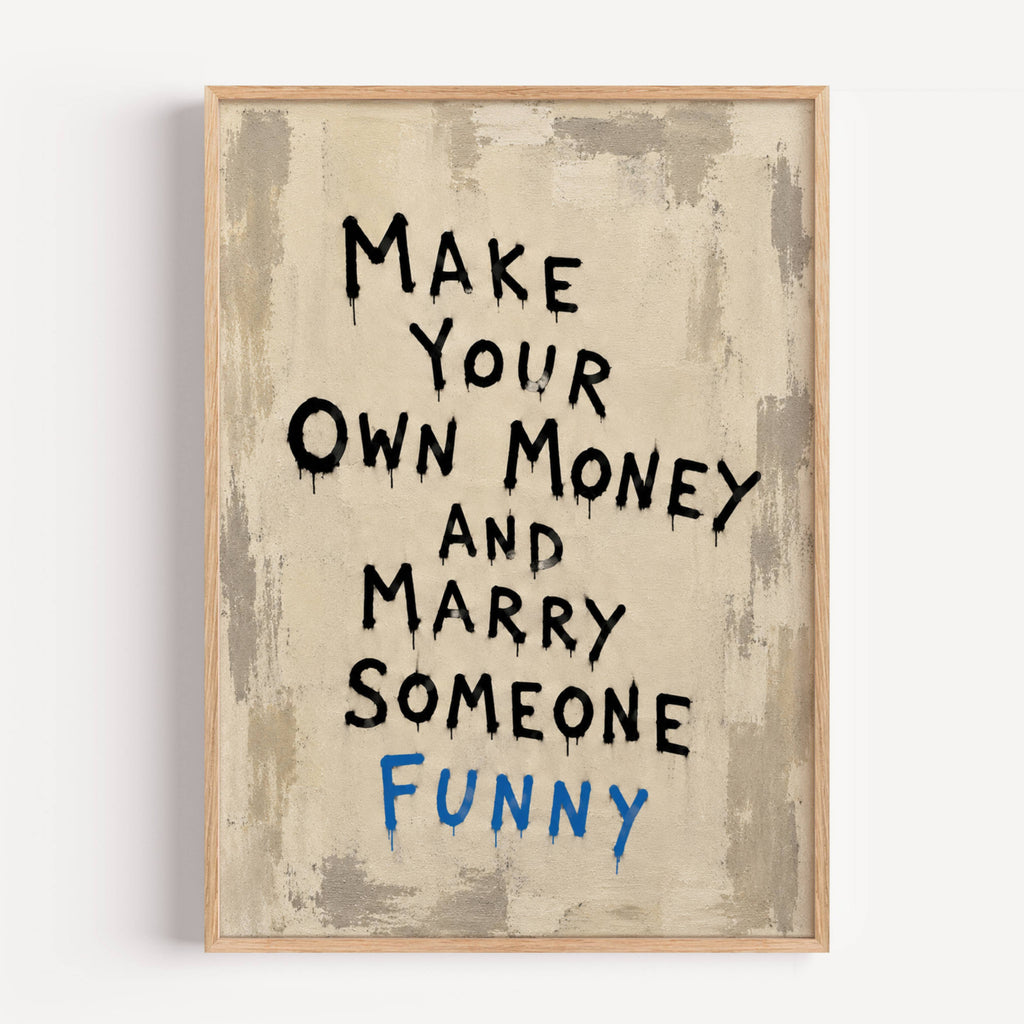 Framed motivational poster with text 'Make Your Own Money and Marry Someone Funny' on a textured beige background.