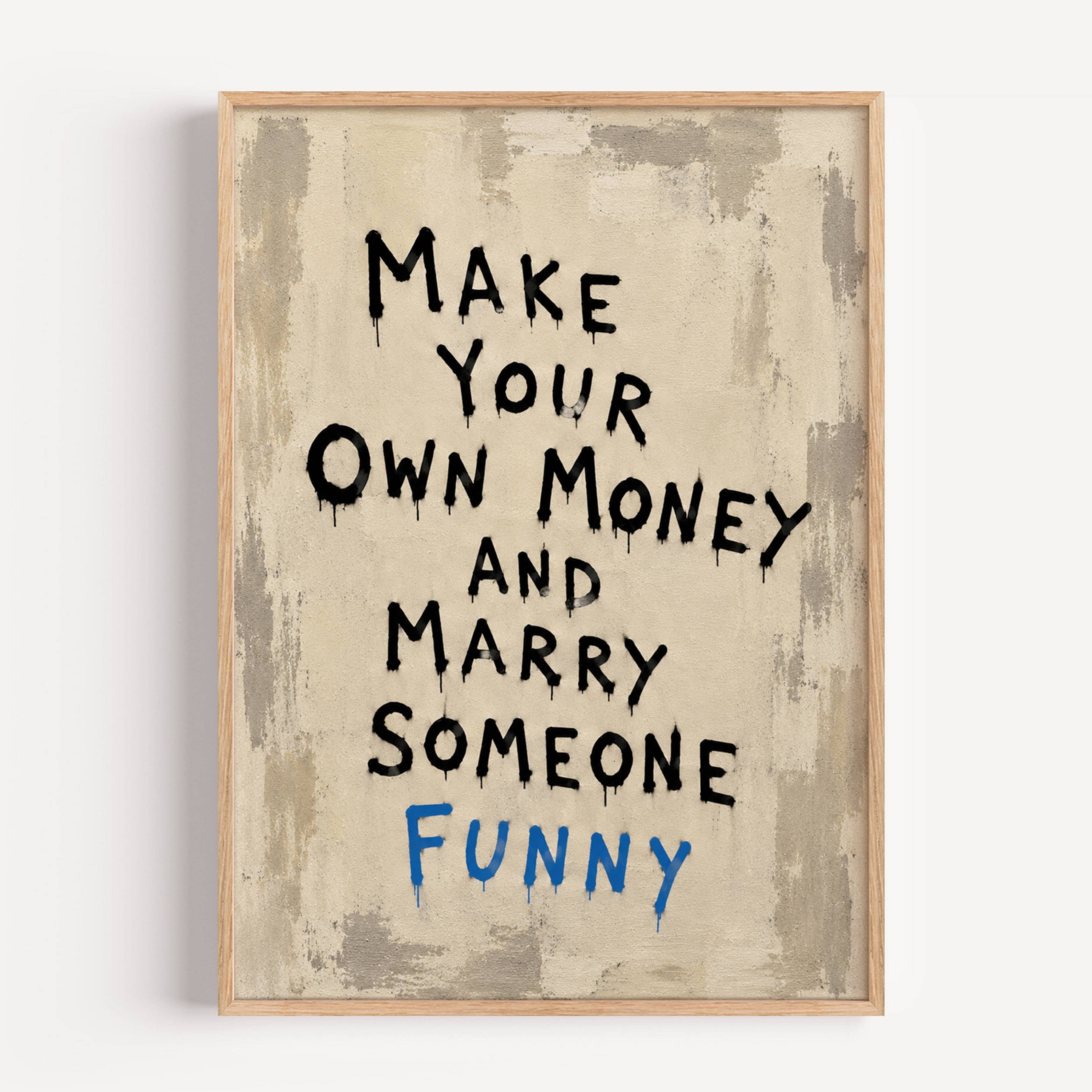 Framed motivational poster with text 'Make Your Own Money and Marry Someone Funny' on a textured beige background.