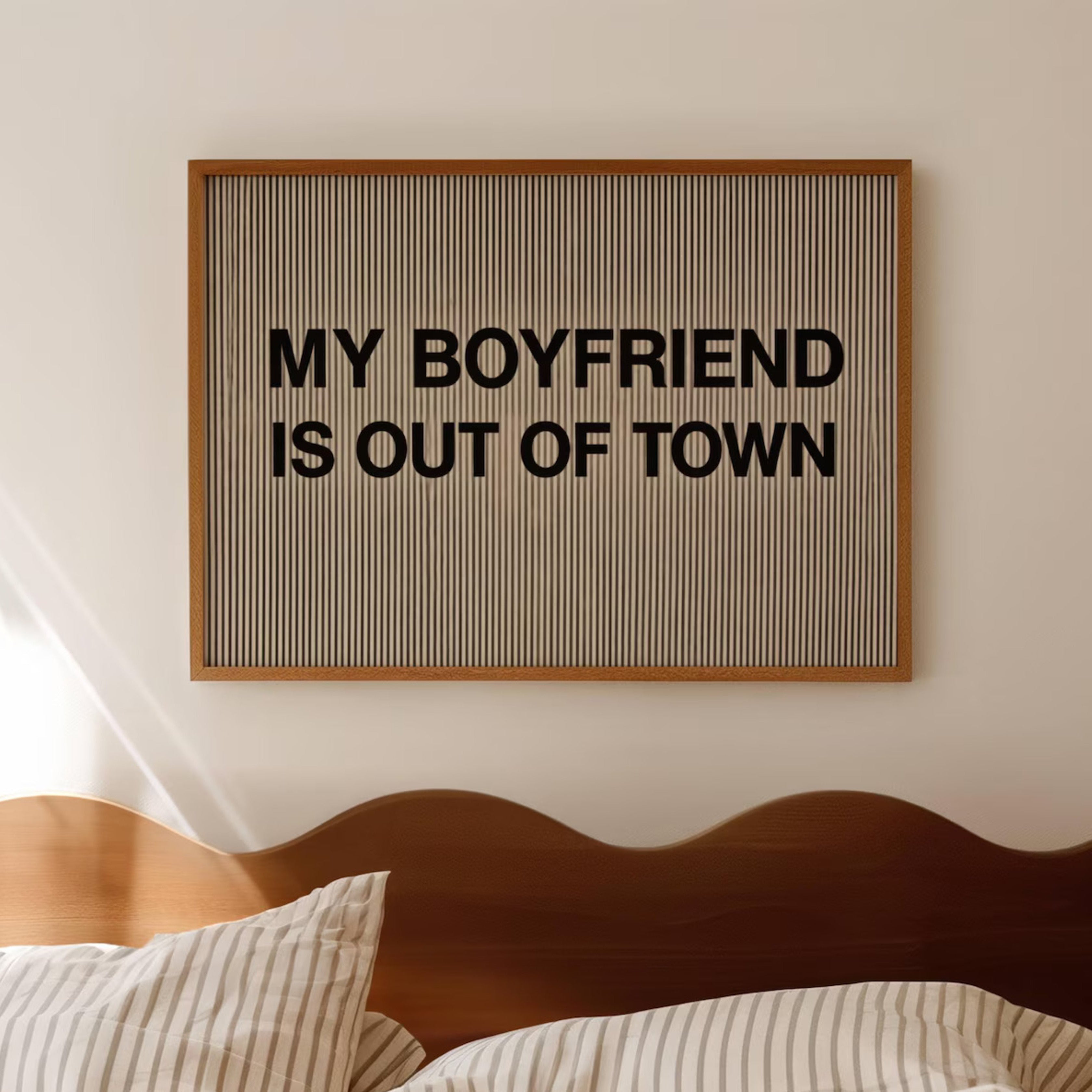 hand drawn Playful Funny typography print with the phrase "MY BOYFRIEND IS OUT OF TOWN" in a retro striped neutral canva. This is a trendy funny typography wall art print ideal for above bed, bedrooms, dorm room decor, living rooms and kitchens, gallery walls and playful interiors. The perfect Cool Girl Apartment decor
