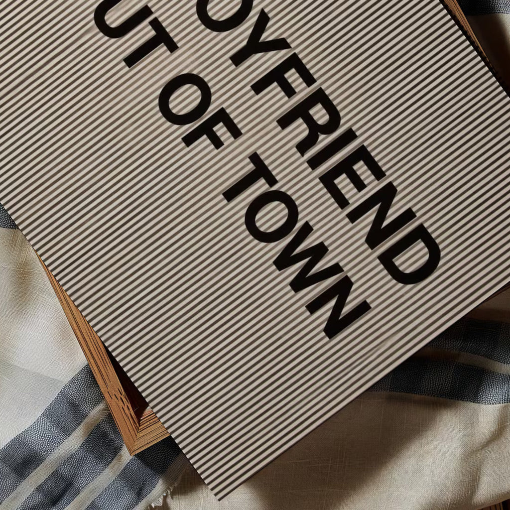hand drawn Playful Funny typography print with the phrase "MY BOYFRIEND IS OUT OF TOWN" in a retro striped neutral canva. This is a trendy funny typography wall art print ideal for above bed, bedrooms, dorm room decor, living rooms and kitchens, gallery walls and playful interiors. The perfect Cool Girl Apartment decor