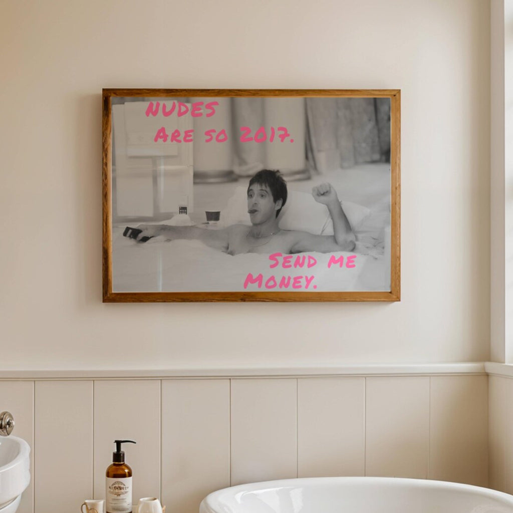 Nudes are so 2017, send me Money is a Funny Typography wall art print with a retro Scarface movie scene of tony montana in the bathtub. This statement artwork brings humour, fashion-girl energy, modern pop culture. Featuring a black-and-white iconic photographic scene paired with bold handwritten neon pink typography, this piece transforms a classic bathroom moment into something witty, stylish, embracing contemporary internet culture. for bathrooms, powder rooms, dressing rooms