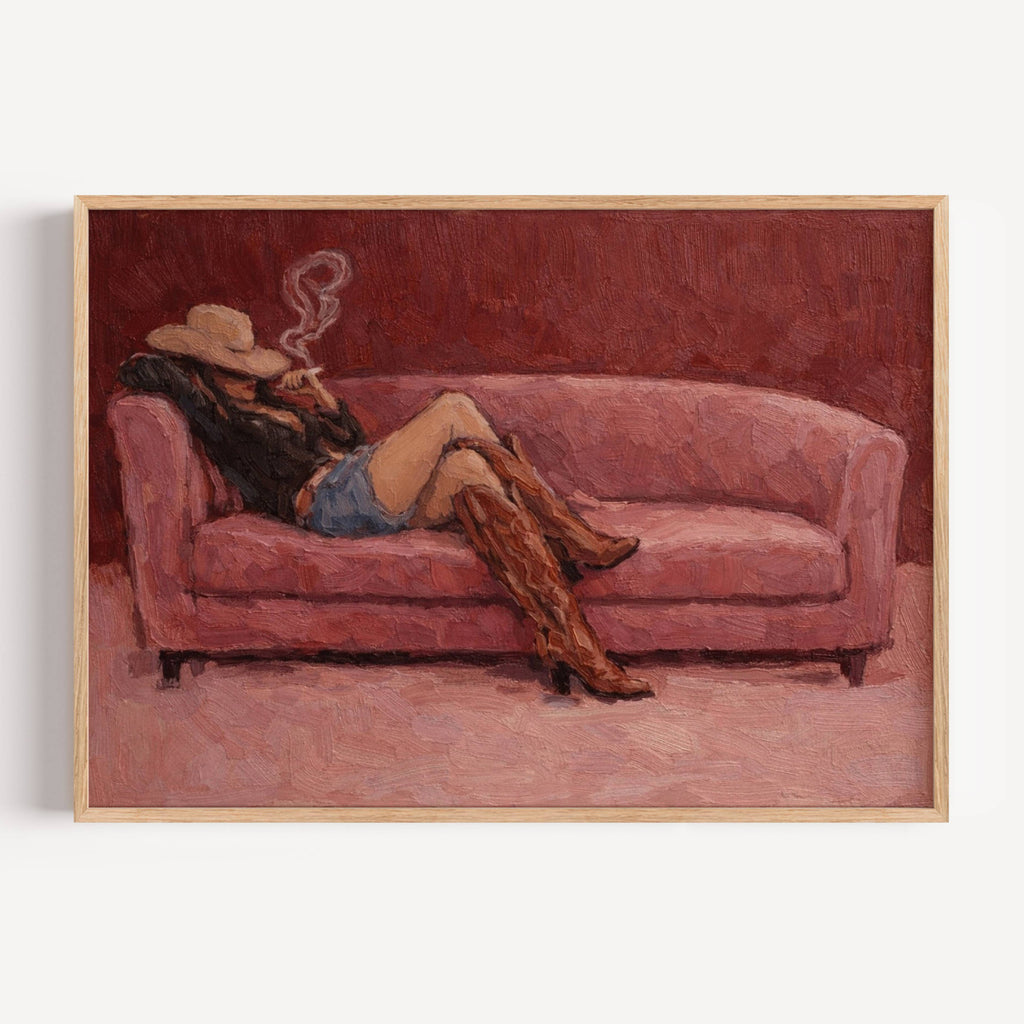 abstract Western wall art featuring an off-duty cowgirl reclining on a blush dusty pink sofa in cowboy boots and cowboy hat, inspired by western and contemporary folk aesthetics. This is a hand drawn Contemporary western art Print Oil Painting.